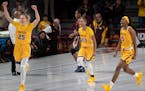 The Gophers' Taiye Bello (5) celebrate after beating Syracuse 72-68 on Thursday