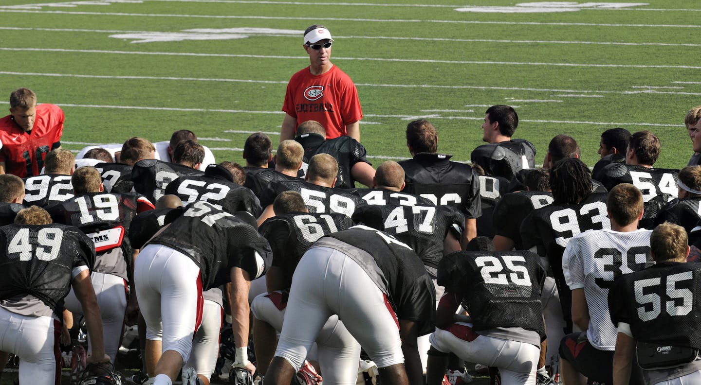 credit St.Cloud Times / Dave Schwarz St. Cloud State head football coach Scott Underwood talks to players following an Aug. 20 scrimmage at Husky Stadium.