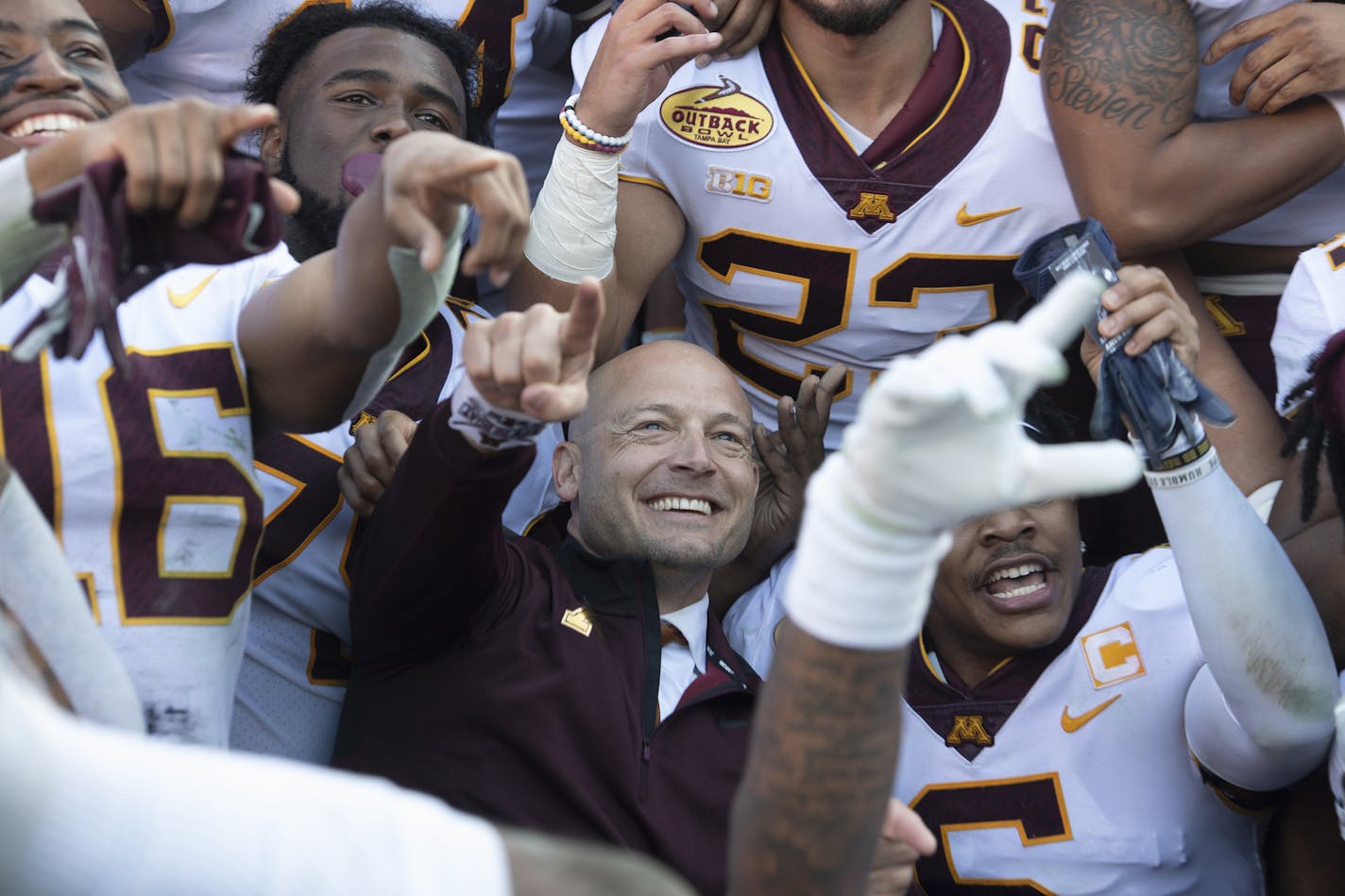 Minnesota Gophers head coach PJ Fleck celebrated with his players during a team photo following their victory against the Auburn Tigers. ] Aaron Lavinsky • aaron.lavinsky@startribune.com The Minnesota Gophers played the Auburn Tigers in the Outback Bowl on Wednesday, Jan. 1, 2020 at Raymond James Stadium in Tampa, Fla.