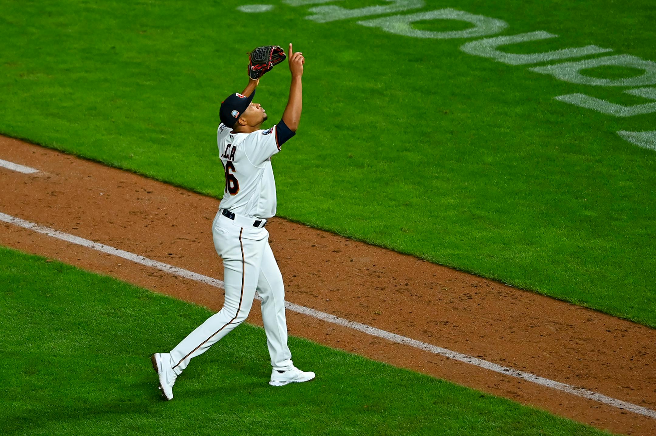 Minnesota Twins relief pitcher Jorge Alcala (66) celebrated after striking out the Brewers' Luis Urias on a foul tip in the top of the 12th inning.