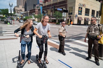 Sophie Konewko and Megan Albers decided to take two Bird scooters for a ride through downtown Minneapolis after lunch. They joked with two Hennepin Co