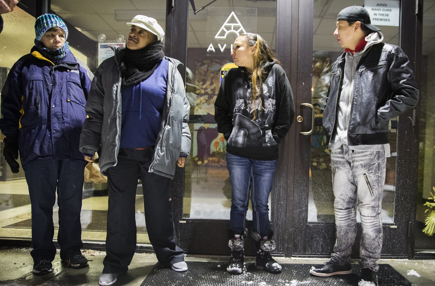 Anthony Feather, from right, waits outside Avivo in the predawn morning hours with Angela Naviosh, Tammy Collins and Amy Gunderson. ] LEILA NAVIDI &#xef; leila.navidi@startribune.com BACKGROUND INFORMATION: People wait in line outside of Avivo in the predawn morning hours to take the Rule 25 chemical health assessment, which they need to qualify for drug treatment, on Friday, February 23, 2018. State and county administrators are taking steps to eliminate longstanding barriers to accessing treat