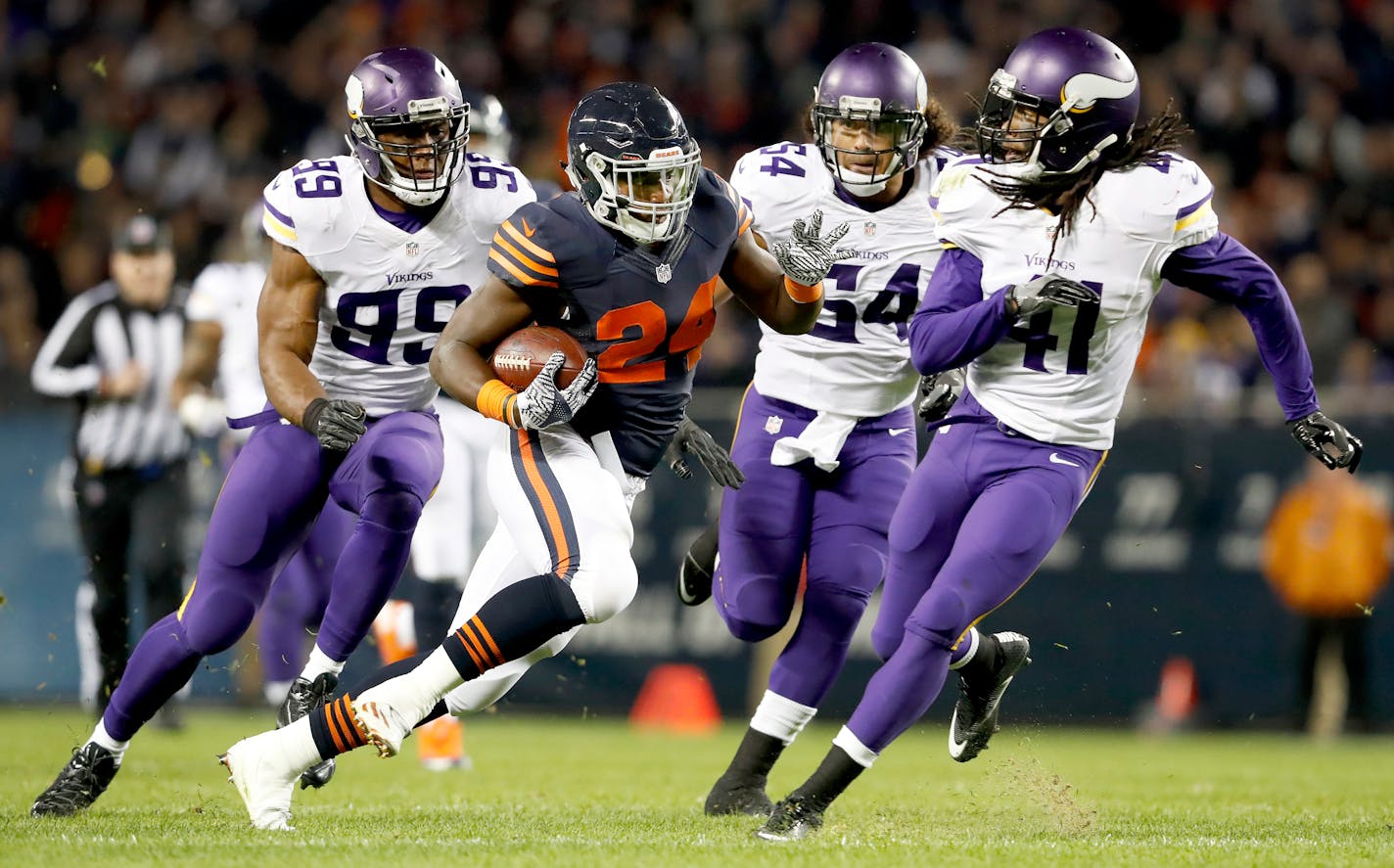 Bears running back Jordan Howard (24) was chased by the Vikings' Danielle Hunter (99), Eric Kendricks (54) and Anthony Harris (41) during a run after catching a shovel pass in the second quarter. ] CARLOS GONZALEZ cgonzalez@startribune.com - October 31, 2016, Chicago, IL, Soldier Field, NFL, Minnesota Vikings vs. Chicago Bears