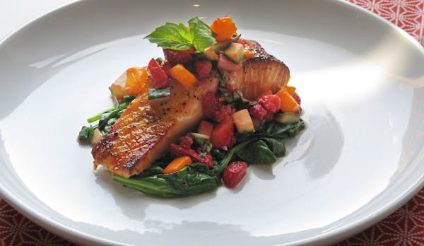 Salmon pairs well with strawberry salsa and spicy spinach. (Susan M. Selasky/Detroit Free Press/MCT) ORG XMIT: 1140383