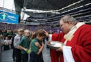 Bishop Bernard Hebda of the Archdiocese of Saint Paul and Minneapolis gave Holy Communion to 12,000 Catholic school children that gathered for Mass of