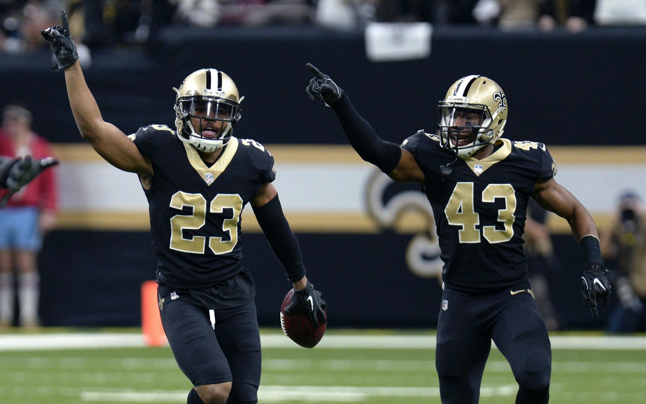 New Orleans Saints cornerback Marshon Lattimore (23) and free safety Marcus Williams (43) celebrate an interception in the first half of an NFL football game against the Atlanta Falcons in New Orleans, Sunday, Dec. 24, 2017. (AP Photo/Bill Feig)
