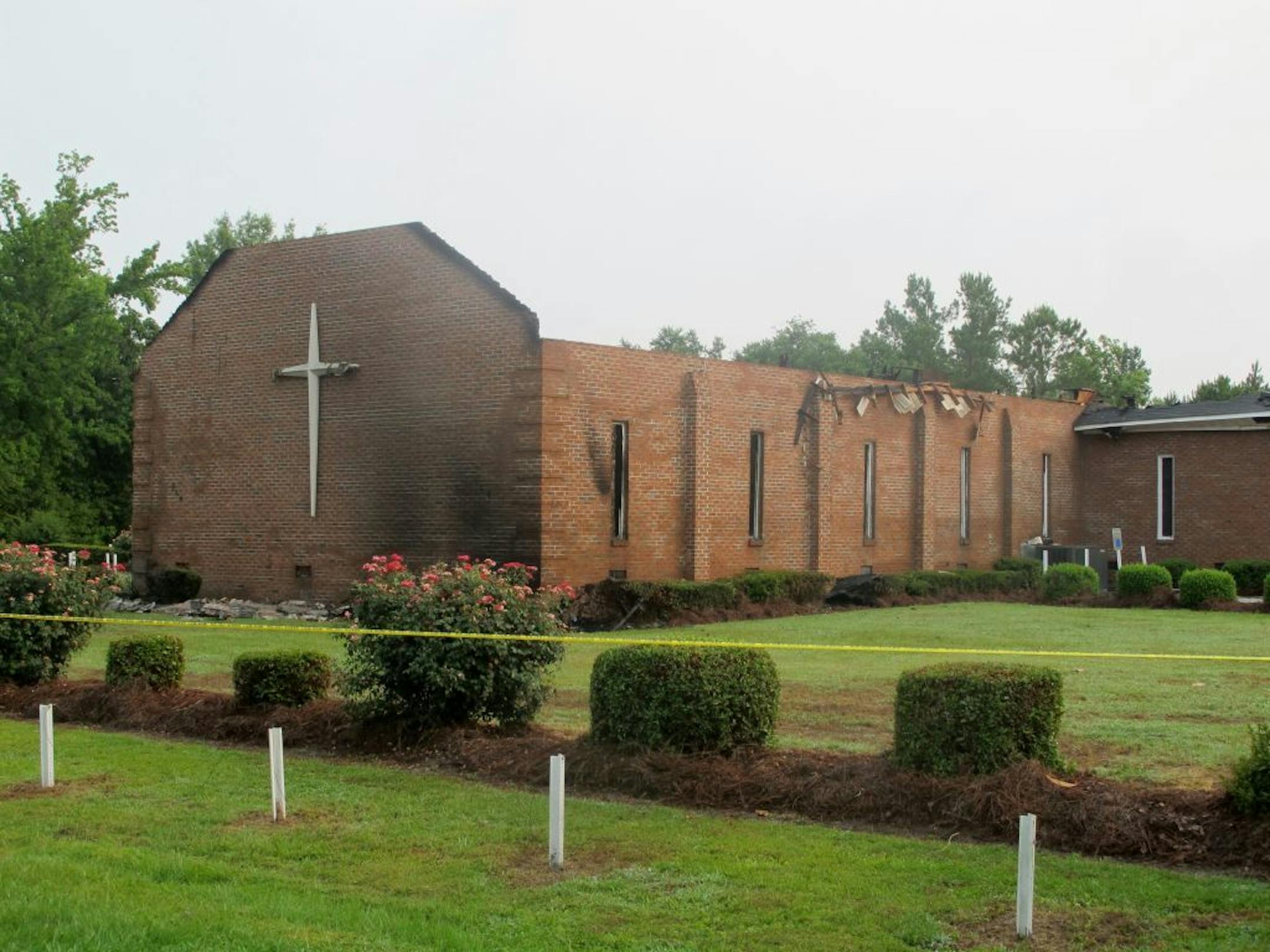 The Mount Zion AME Church in Greeleyville, S.C., is seen on Wednesday, July 1, 2015, after it was heavily damaged by fire. The church was the target of arson by the Ku Klux Klan two decades ago but a law enforcement source told The Associated Press that the most recent fire was not arson.