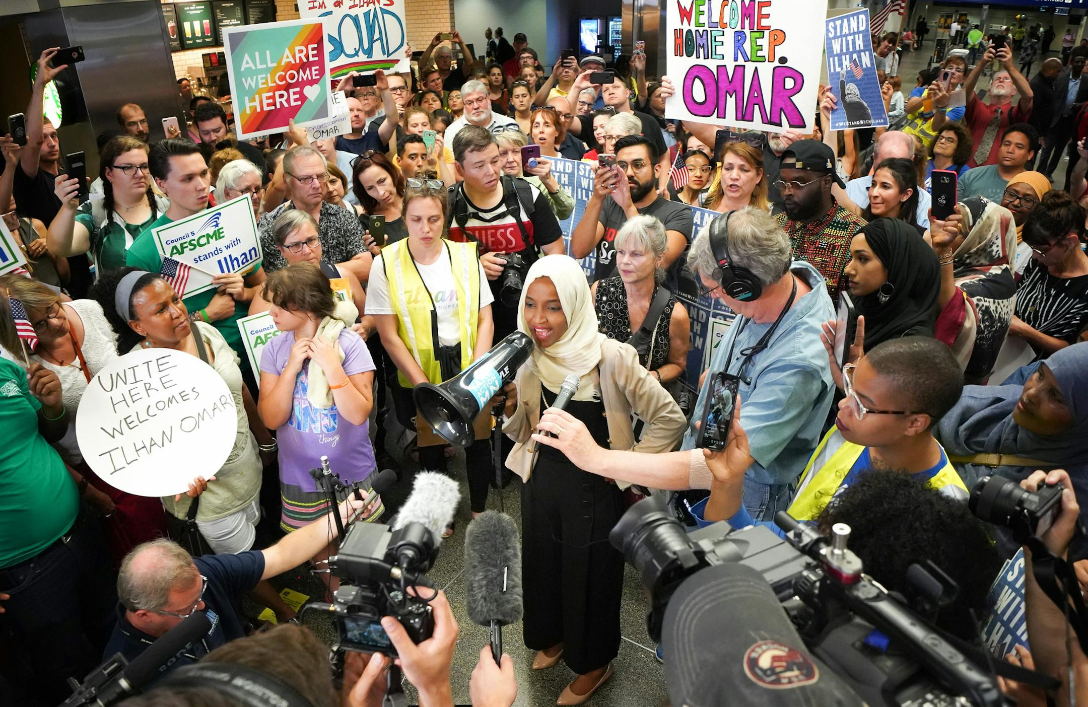 Rep. Ilhan Omar was greeted Wednesday by more than a hundred supporters cheering "Welcome Home Ilhan" as she arrived home to MSP Airport. This in the wake of increased attacks from the president and chants of "Send her back" at a rally Wednesday. ] GLEN STUBBE • glen.stubbe@startribune.com Thursday, July 18, 2019