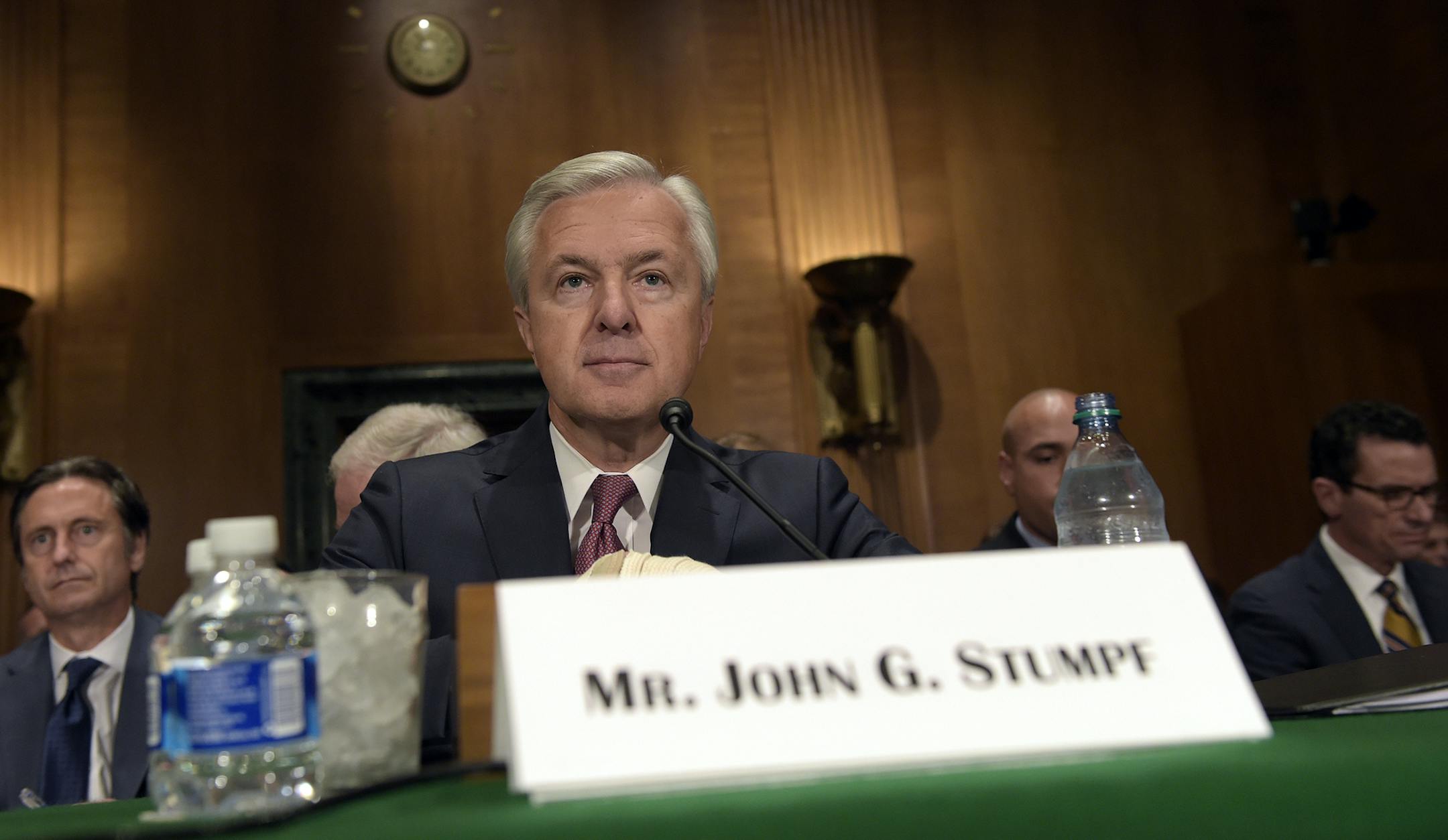 Wells Fargo Chief Executive Officer John Stumpf prepares to testify on Capitol Hill in Washington, Tuesday, Sept. 20, 2016, before Senate Banking Committee. Strumpf was called before the committee for betraying customers' trust in a scandal over allegations that employees opened millions of unauthorized accounts to meet aggressive sales targets. (AP Photo/Susan Walsh) ORG XMIT: MIN2016092111261213