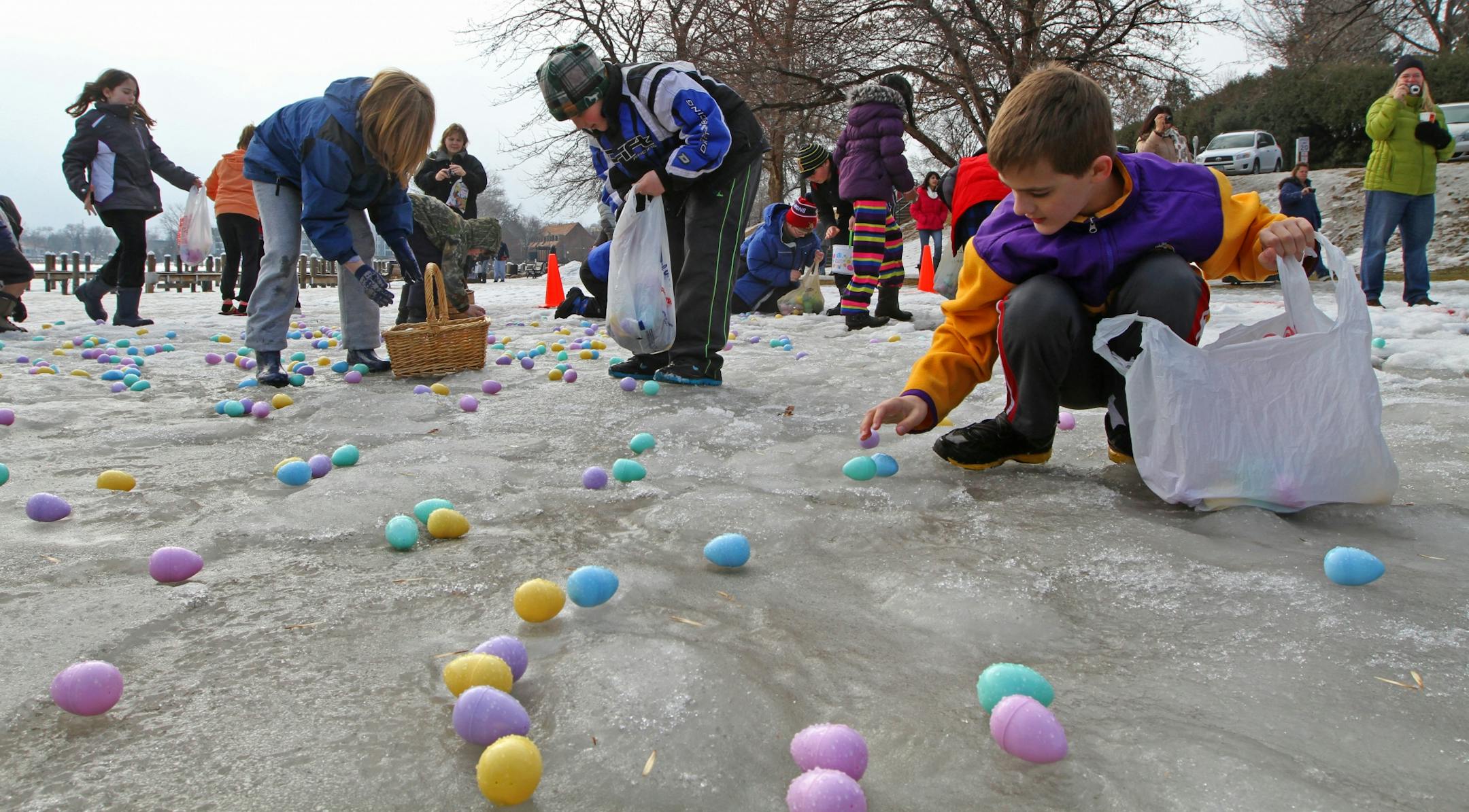 Kids age 9 to 11 scrambled for eggs at the start of the 15th annual Community Easter Egg Hunt, sponsored by Our Savior Lutheran Church, where more than 500 Kids from around the west-metro area, ages toddler through 11 hunted for easter eggs in the snow and ice. A popular area tradition, this year's event was highlighted by four separate Easter Egg Hunts, for ages 2 & under, ages 3-5, ages 6-8, and 9-11. More than 16,000 plastic eggs, filled with candy and prizes, were scattered throughout the ev