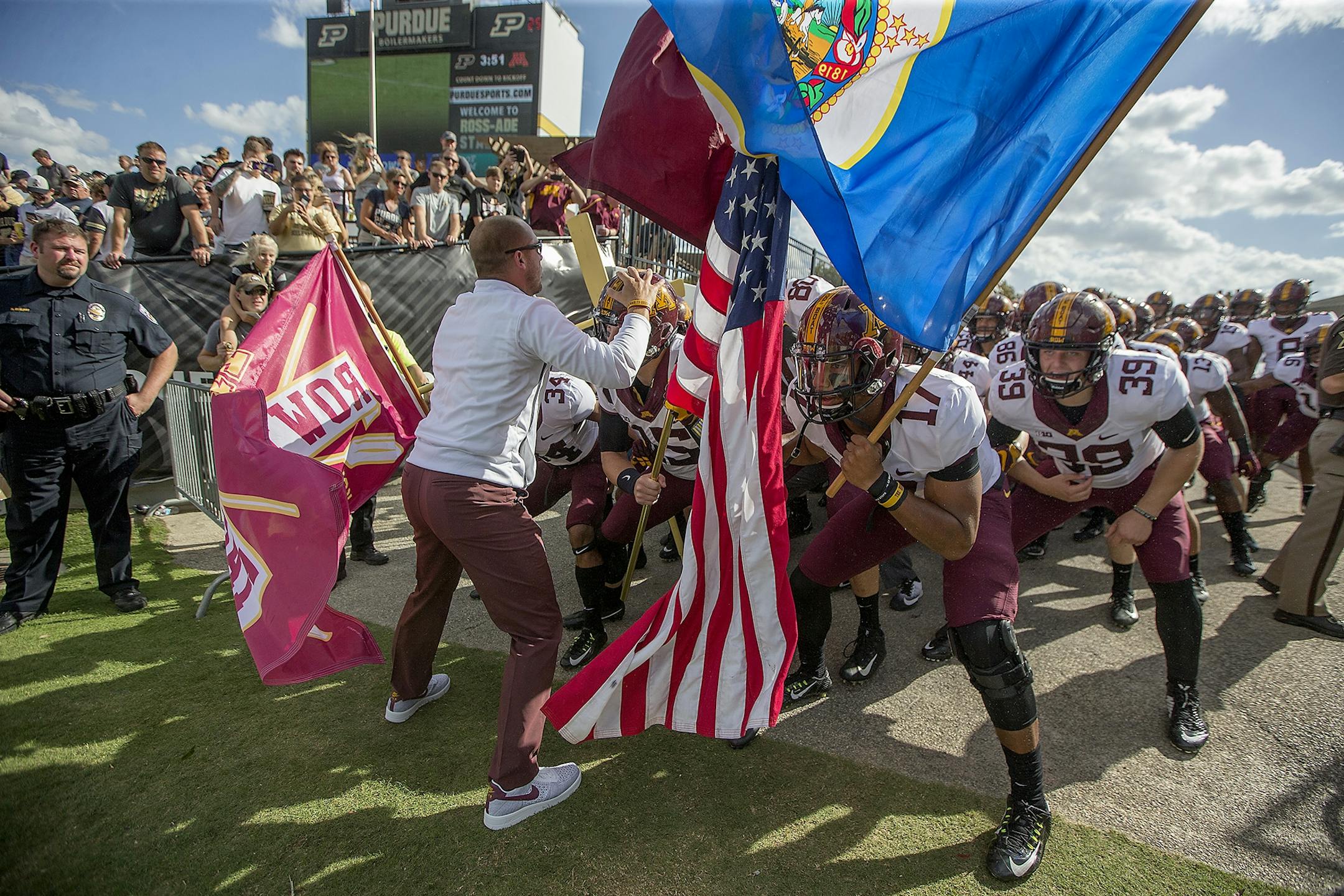 Minnesota's Head Coach P. J. Fleck led his team onto the field before the Gophers took on Purdue at Ross-Ade Stadium, Saturday, October 7, 2017 in West Lafayette, IN.