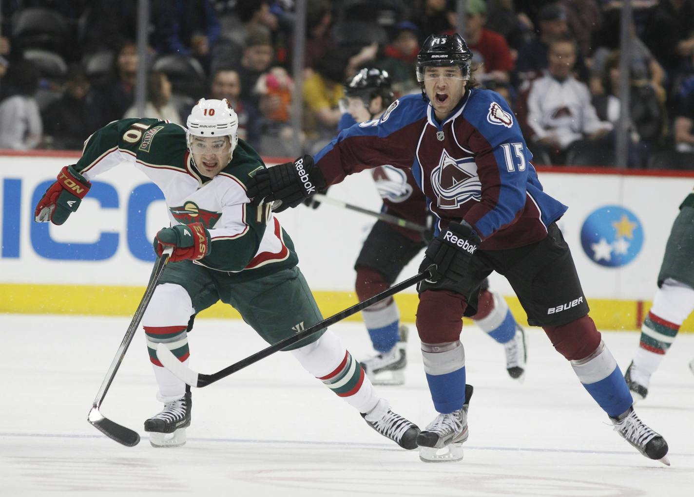 Wild right winger Devin Setoguchi, left, pursued the puck along with Avalanche right winger P.A. Parenteau in the first period Saturday.