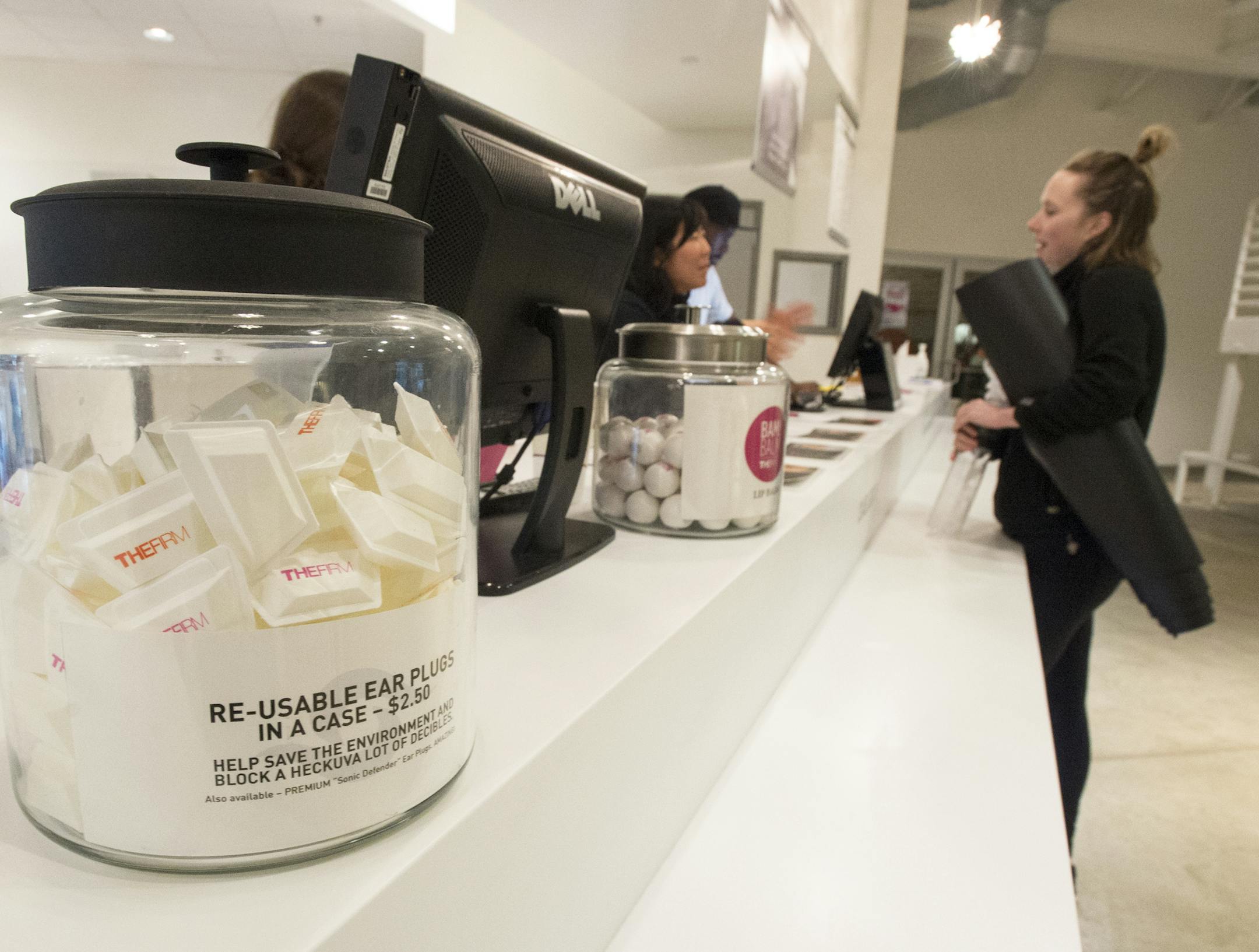 The Firm sells ear plugs at the front counter for $2.50 for patrons sensitive to loud music. ] (AARON LAVINSKY/STAR TRIBUNE) aaron.lavinsky@startribune.com Kelly Miyamoto's spin class was photographed at The Firm on Tuesday, Nov. 10, 2015 in Minneapolis. We check into complaints that the soundtrack for fitness classes at gyms are just TOO LOUD! Health experts say the cranked-up volume is hurting all of us.