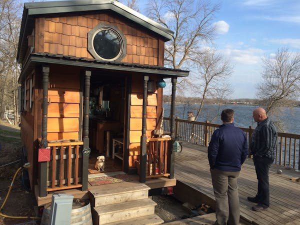 Attendees at a tiny house conference in the Twin Cities paid a visit to the tiny home of Kim and Ryan Kasl, which is set on a lake in south central Mi