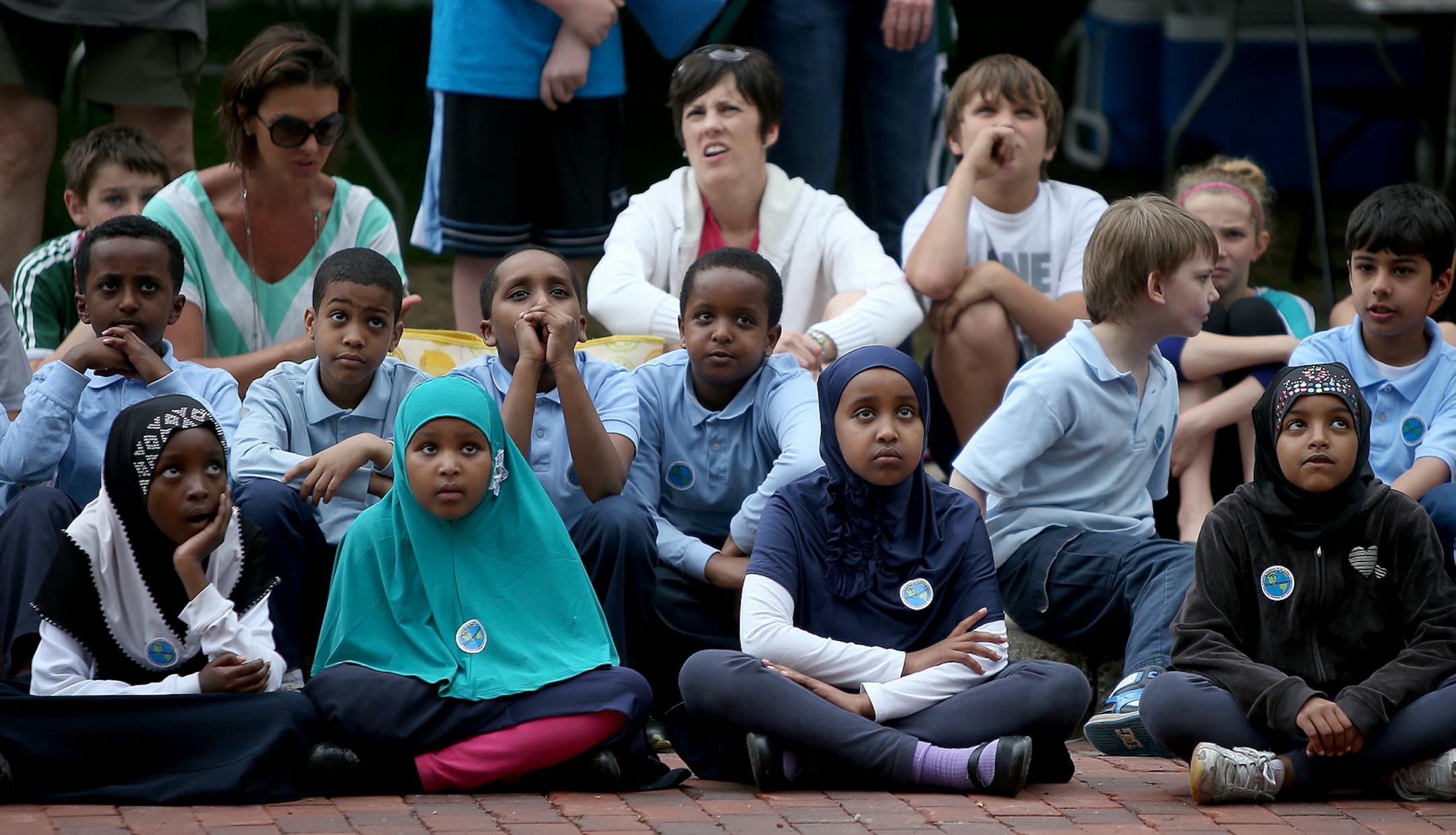 Global Academy students watched the Cirque Mechanics' Gantry Bike performance during the 14th Annual Flint Hills International Children's Festival, Thursday, May 27, 2014 in St. Paul, MN. ] (ELIZABETH FLORES/STAR TRIBUNE) ELIZABETH FLORES • eflores@startribune.com