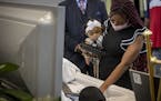 Mikayshia Horton, the daughter of Calvin L. Horton Jr. held his granddaughter Mi'kayah Horton as she said goodbye to him before the coffin was closed 