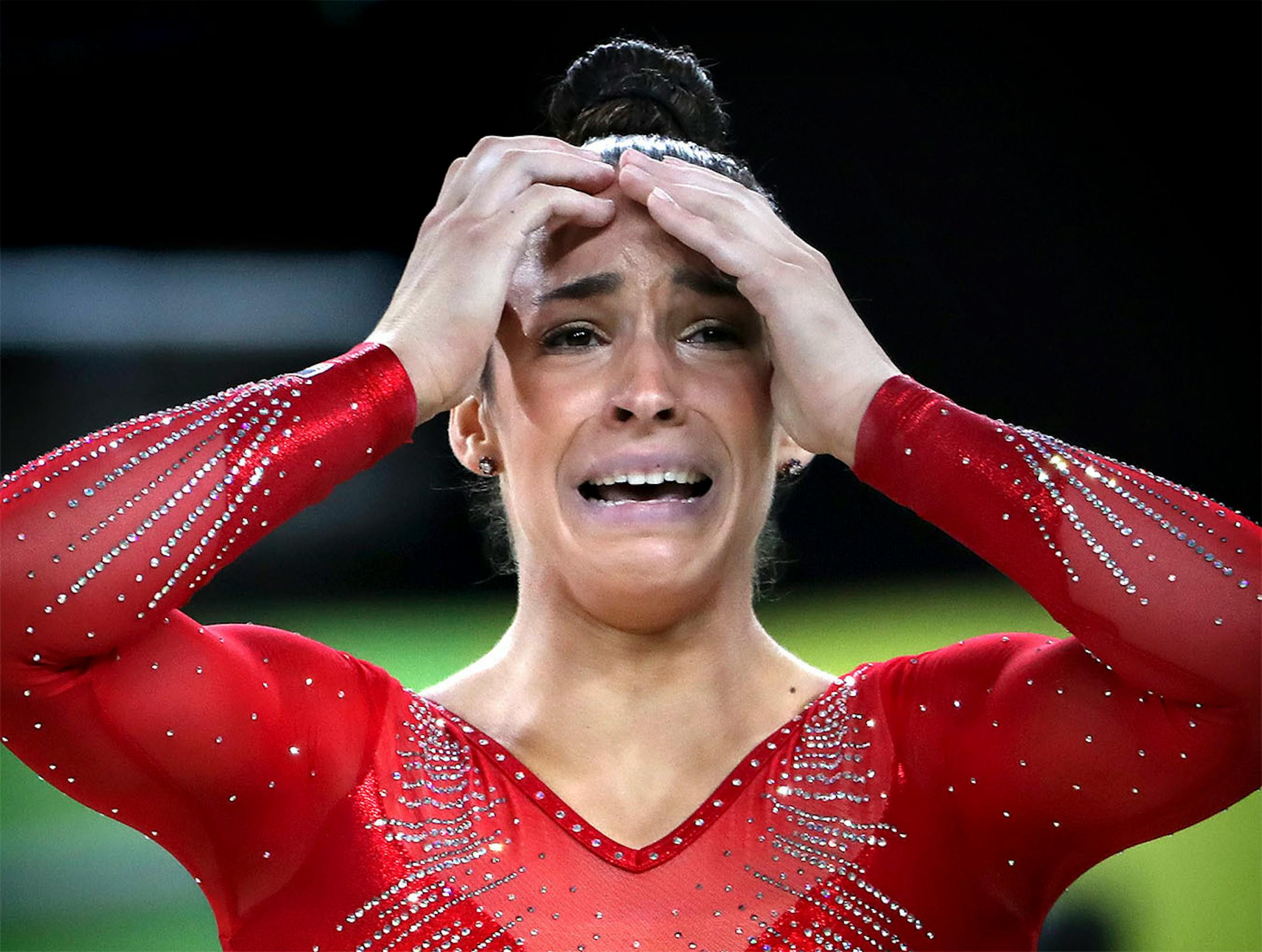 USA's Simone Biles won the all around title in women's gymnastics and her teammate Alexandra Raisman took home the silver. HEre, Alexandra Raisman breaks down in tears after her final floor exercise drew loud cheers from the crowd.