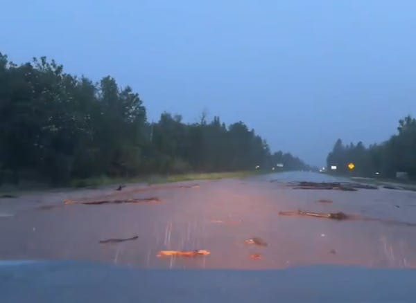 Hwy. 61 is flooded entering Tofte, Minn., on Tuesday night.