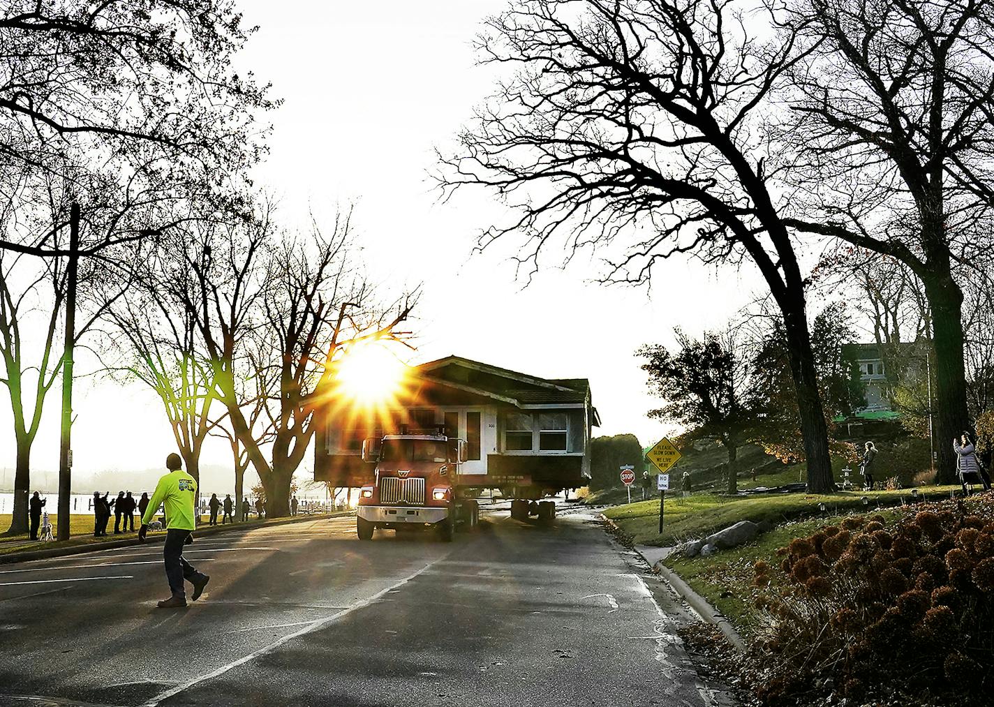 The century-old house, the subject of a dispute over historic preservation, inched down Excelsior's Lake Street on Friday en route to its new site nearby.