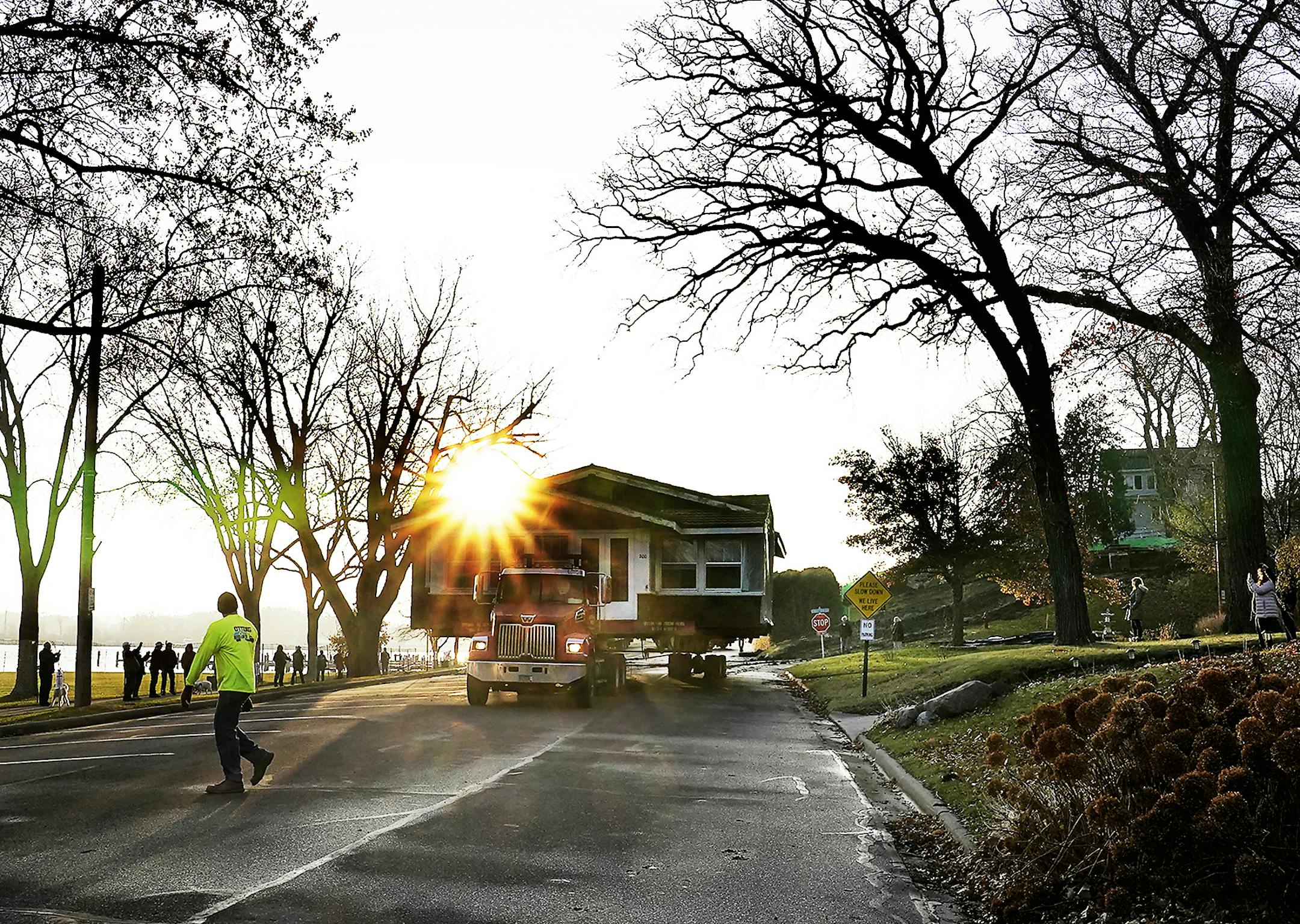 The century-old house, the subject of a dispute over historic preservation, inched down Excelsior's Lake Street on Friday en route to its new site nearby.