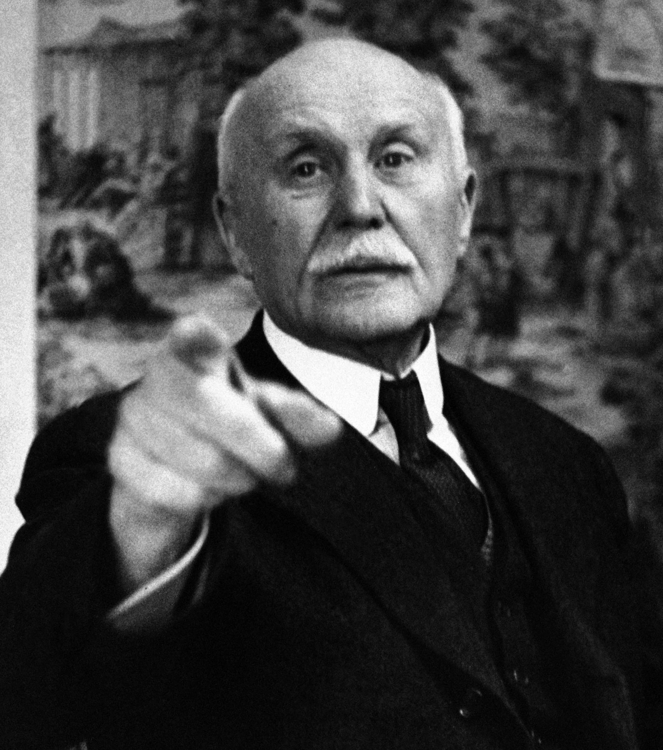 FILE - This June 9, 1941file photo shows France's Marshal Philippe Petain pointing as he ordered our photographer from the room during the sell-out meeting of the Council of Ministers in Vichy, central France. French President Emmanuel Macron waded onto controversial ground Wednesday Nov.7, 2018 by praising a World War I general who subsequently collaborated with the Nazis in World War II.(AP Photo, File)