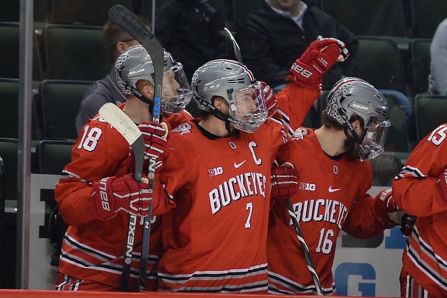 Ohio State Buckeyes forward Luke Stork (18), forward Nick Schilkey (7) and forward Matthew Weis (16) celebrated a goal in the first period against the Minnesota Golden Gophers.