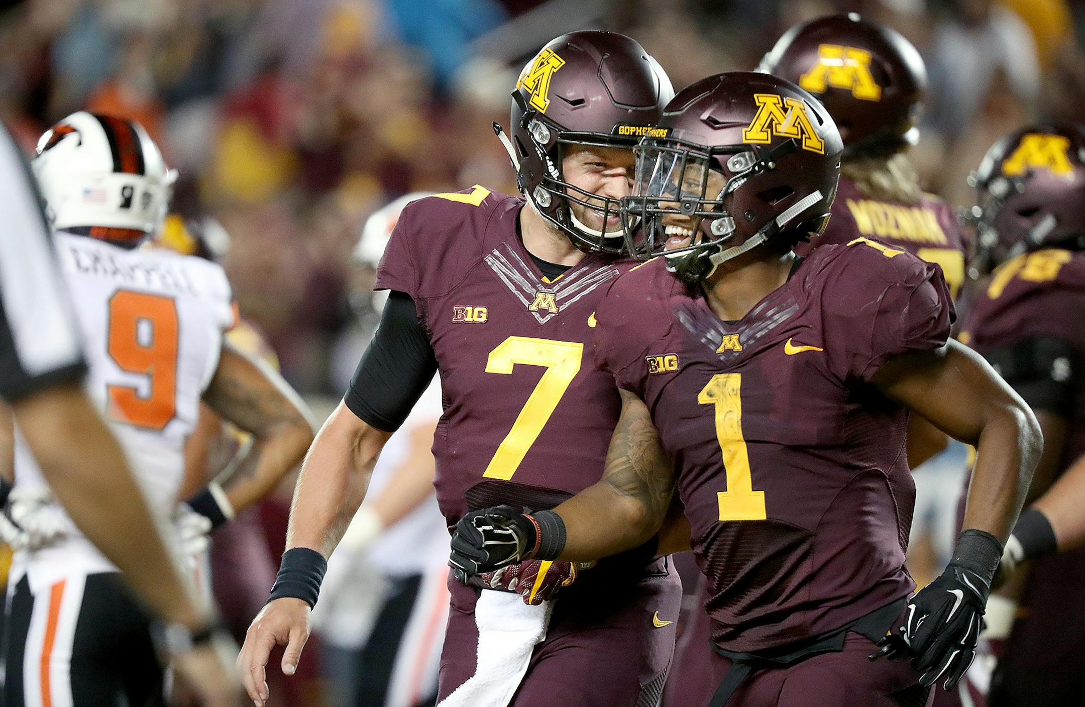 Minnesota Gophers quarterback Mitch Leidner, left, and Gophers running back Rodney Smith celebrated his touchdown in the fourth quarter as the Gophers took on Oregon State at TCF Bank Stadium, Thursday, September 1, 2016 in Minneapolis, MN. ] (ELIZABETH FLORES/STAR TRIBUNE) ELIZABETH FLORES • eflores@startribune.com