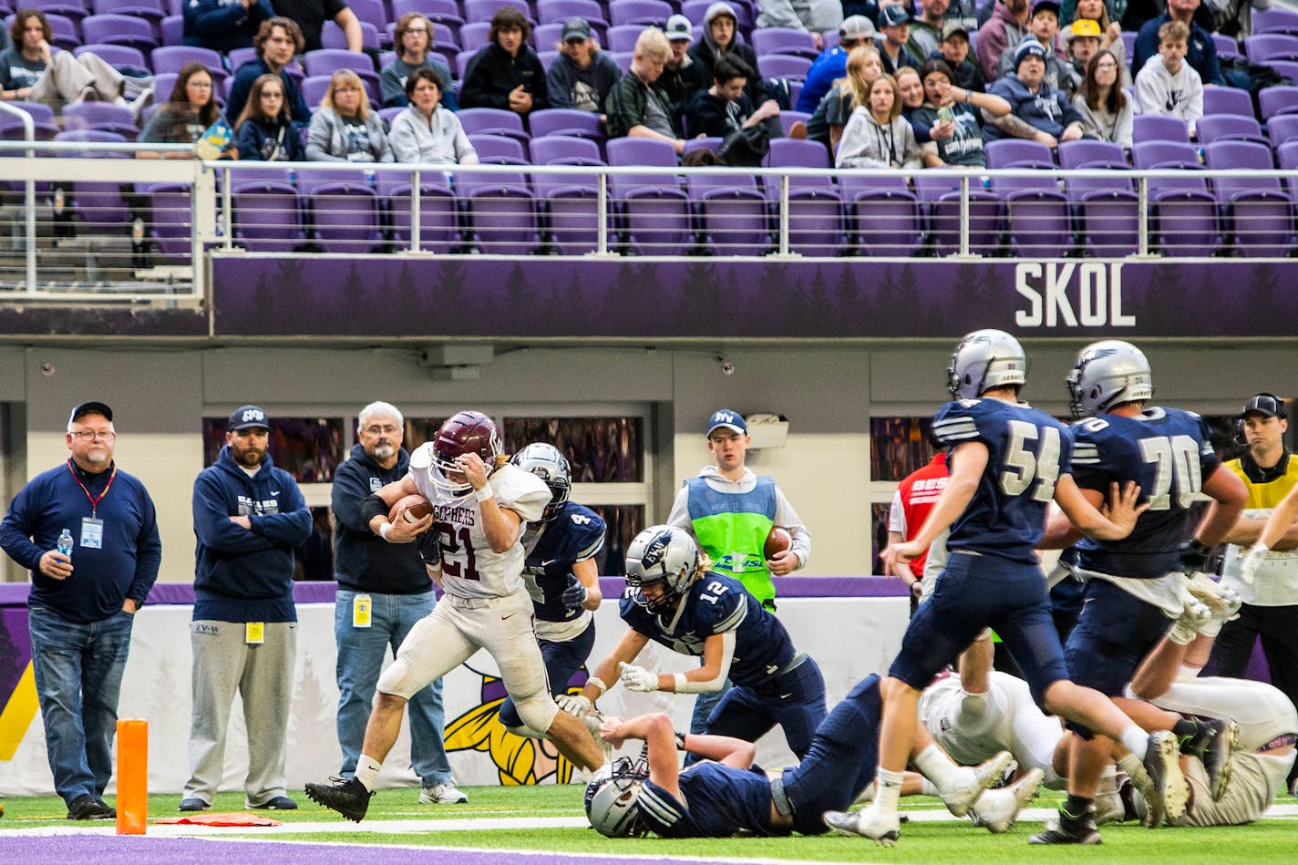 Chatfield's Sam Backer (21) breaks free for a second quarter touchdown run during a Class AA state semifinal football game against Eden Valley-Watkins on Friday, Nov. 18, 2022, at U.S. Bank Stadium in Minneapolis.