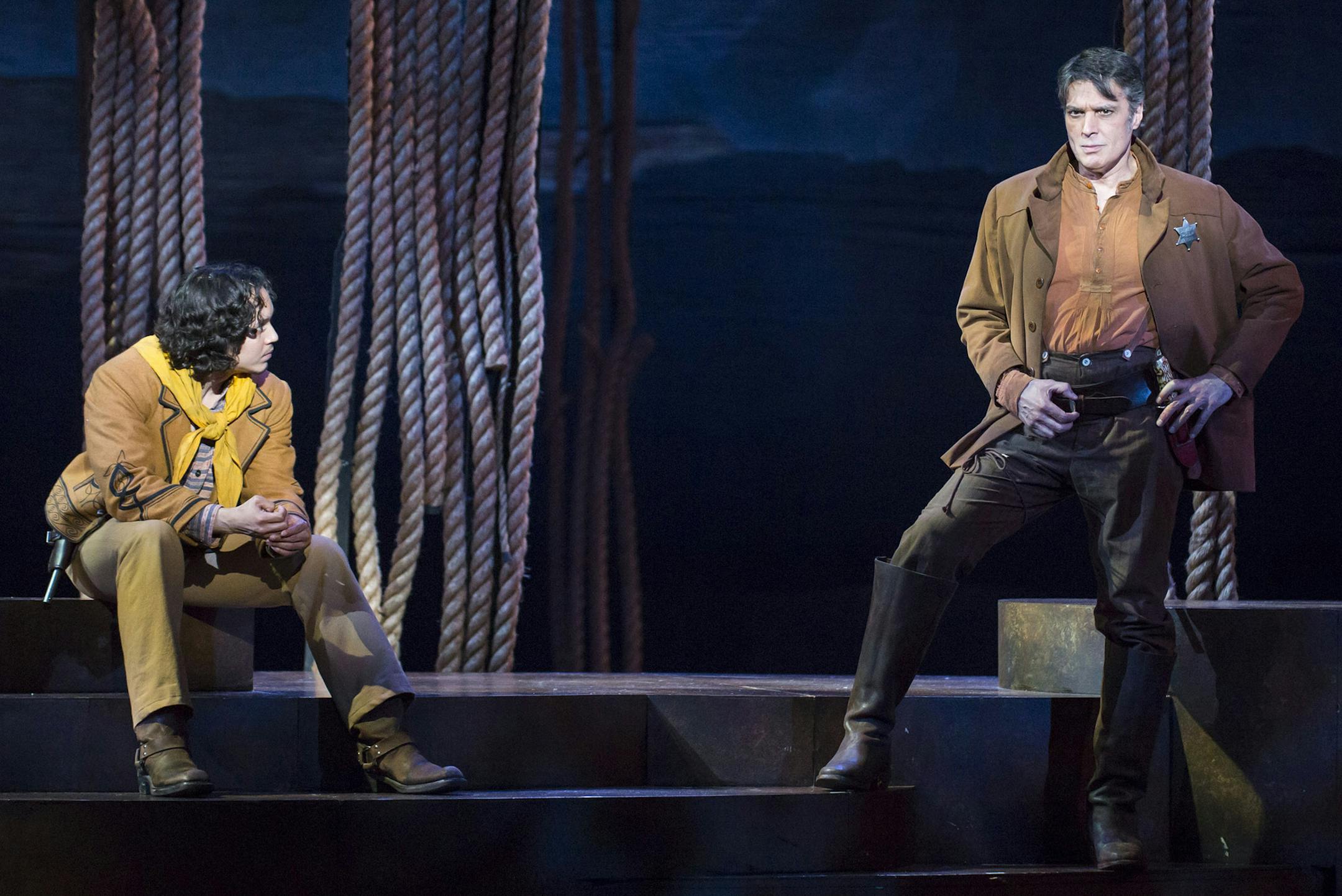 Armando (Justin Gregory Lopez) and Ben Rumson (Robert Cuccioli) in Lerner & Loewe's "Paint Your Wagon" at The 5th Avenue Theatre. Photo credit Tracy Martin