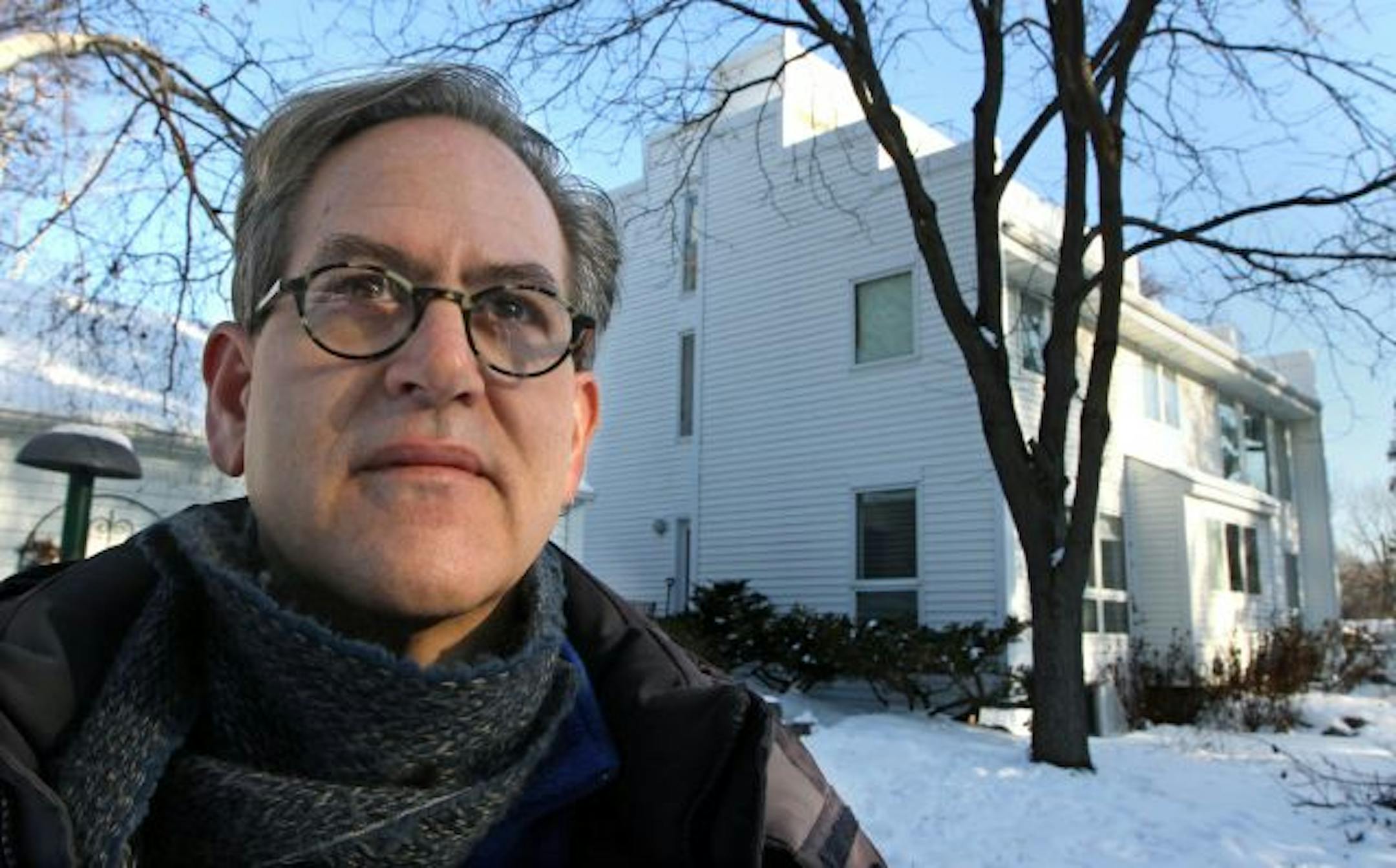 Michael Rice stood outside his Golden Valley home that is currently covered in white vinyl siding. Michael and his wife, Katja are trying to get Golden Valley to change the housing ordinance that forbids houses to be sided with steel. They want to reside their modern house with corrugated steel.