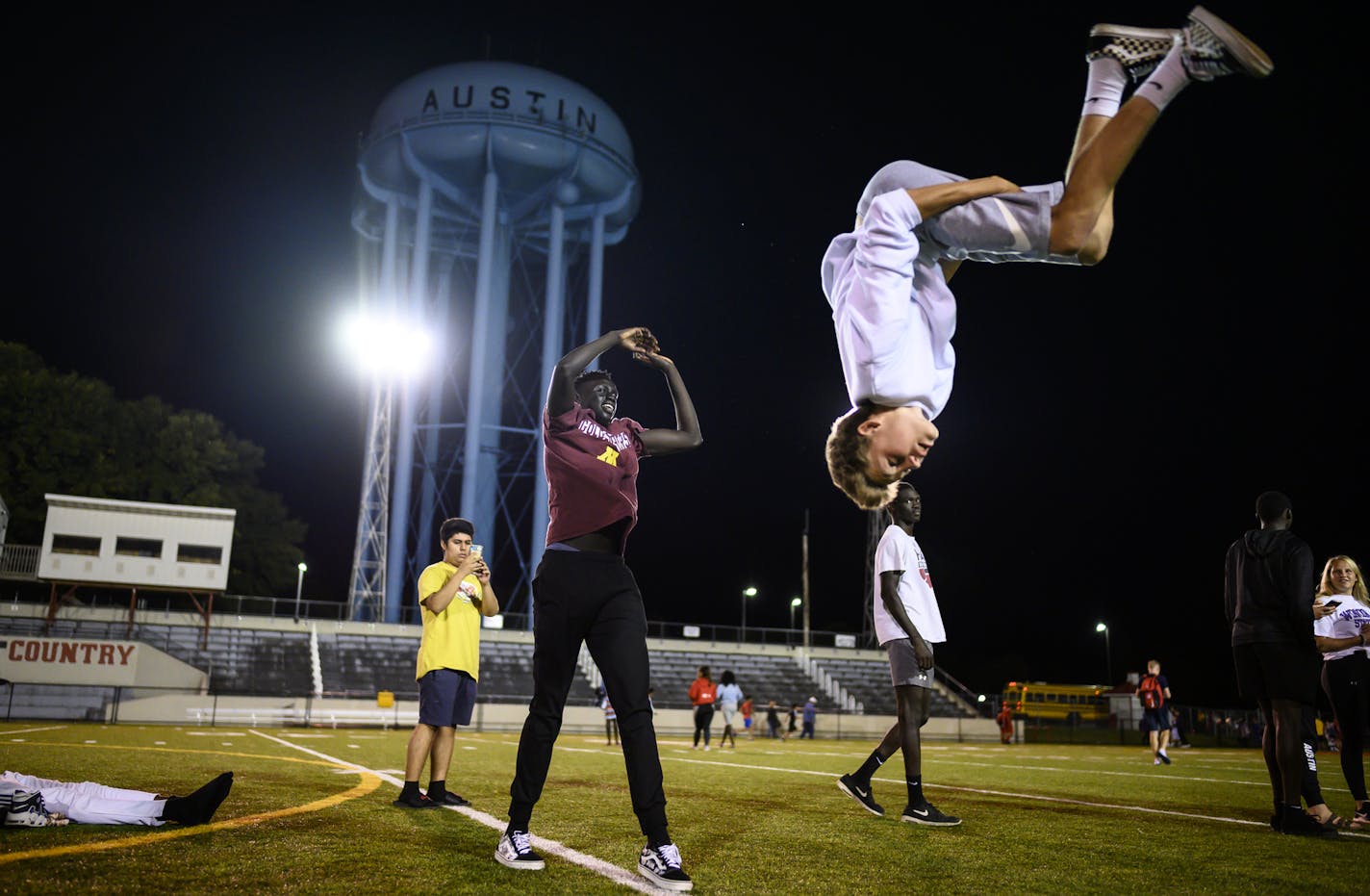 Austin high school junior Jordan Ransom was flipped into the air by classmate Dieth Duop after they attended a soccer game at Wescott Field against Lourdes in September. The two are close friends and play basketball together, frequently hanging out in Ransom's basement, playing video games. ] Aaron Lavinsky &#x2022; aaron.lavinsky@startribune.com Photos to accompany a feature on the ethnic diversification of Austin Minn., as seen through the Austin High School boys basketball and soccer programs