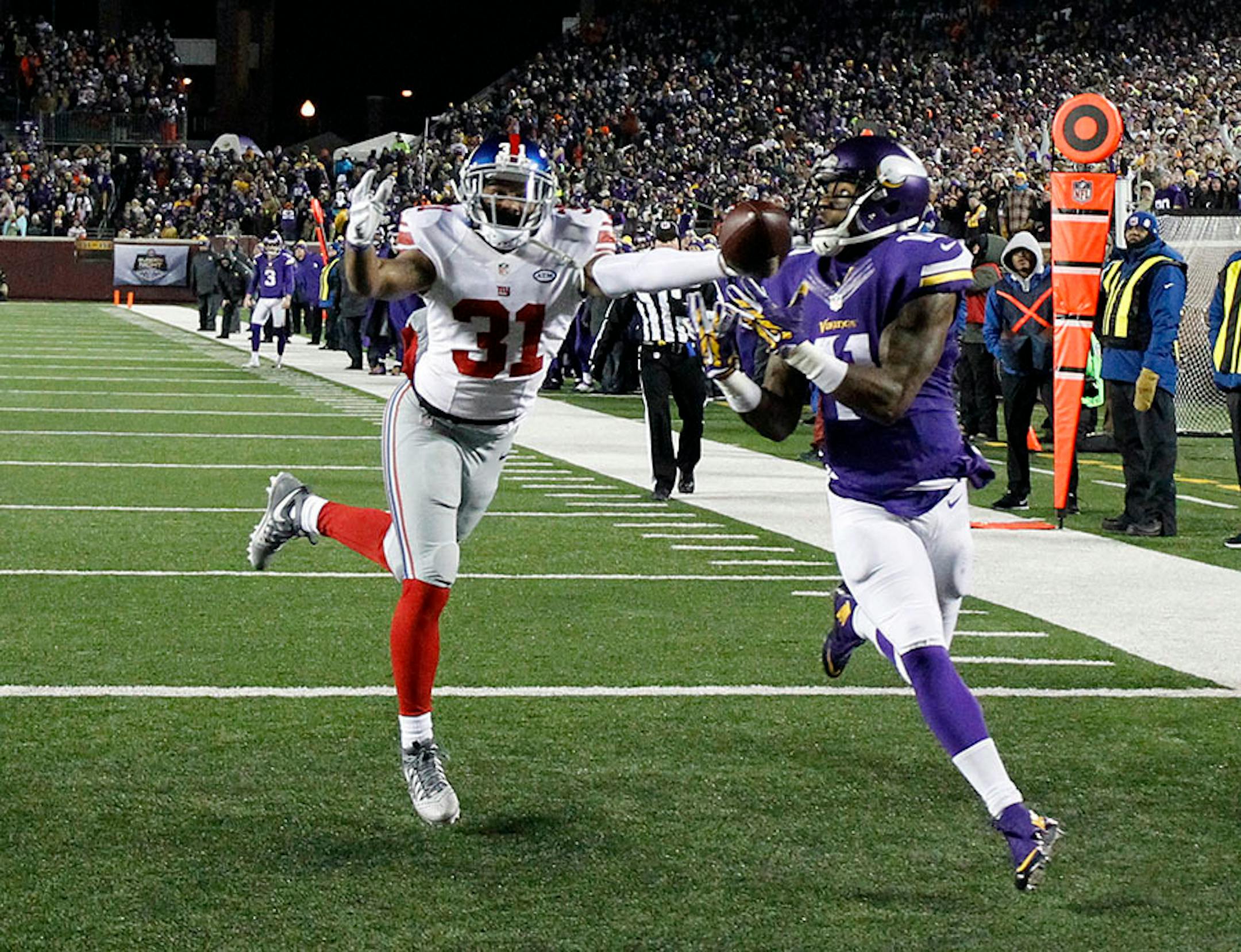 New York Giants defensive back Trevin Wade (31) defends as Minnesota Vikings wide receiver Mike Wallace (11) can't make the catch during the first half of an NFL football game Sunday, Dec. 27, 2015, in Minneapolis.