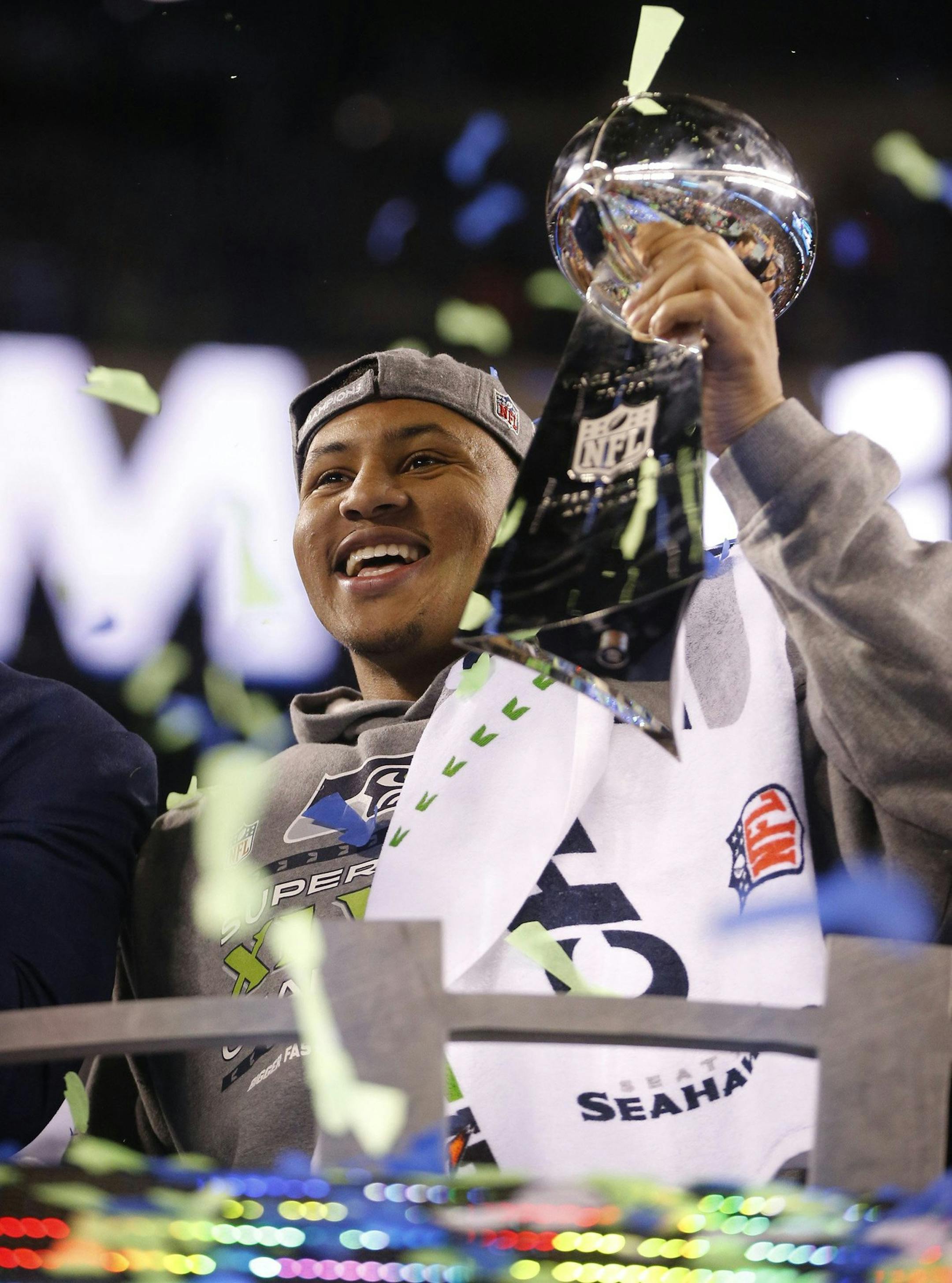 Super Bowl MVP Malcolm Smith celebrates after a 43-8 victory against the Denver Broncos in Super Bowl XLVIII at MetLife Stadium in East Rutherford, N.J., on Sunday, Feb. 2, 2014. (Tony Overman/The Olympian/MCT)