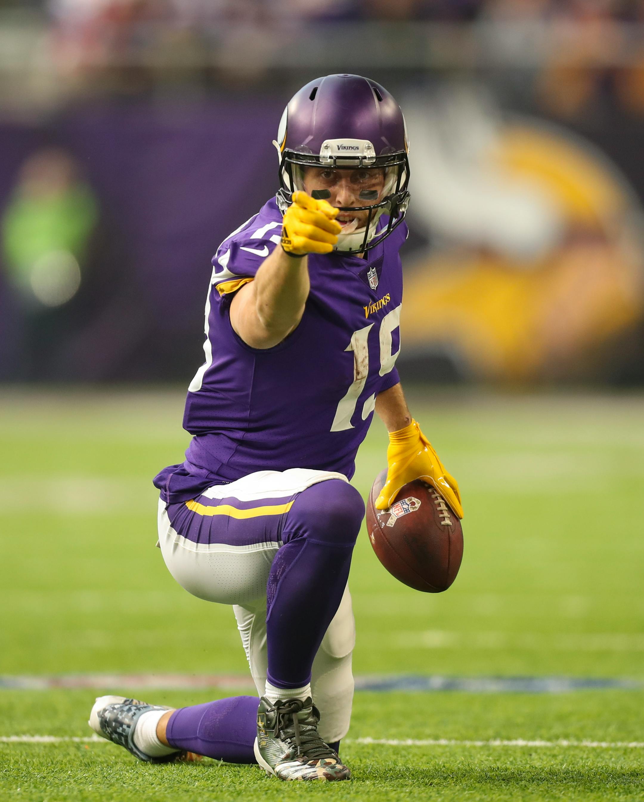 Minnesota Vikings wide receiver Adam Thielen signaled a first down after he caught a pass towards the end of the first quarter for a 12 yard gain.