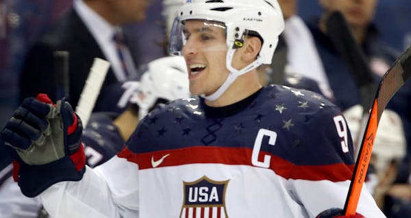 Zach Parise celebrated with teammates after he scored in the second period. USA beat Czech Republic 5-2.