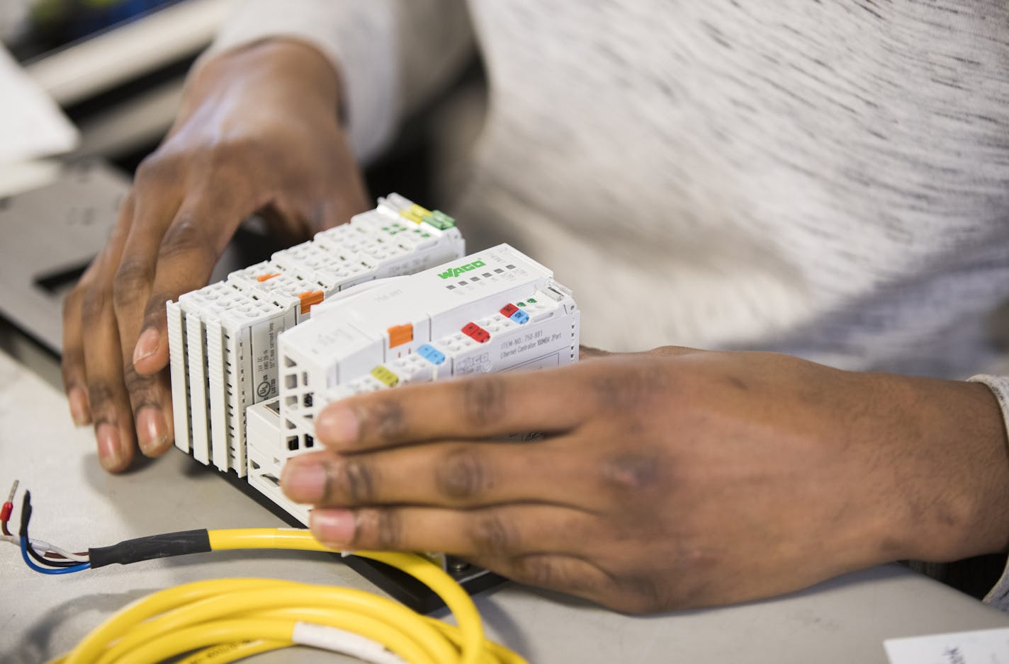 Kamonty Wade works on building an ethernet hub box at Rudolph Technologies. ] LEILA NAVIDI &#xef; leila.navidi@startribune.com BACKGROUND INFORMATION: Kamonty Wade, a Summit Academy graduate, works at Rudolph Technologies in Bloomington on Friday, March 17, 2017. In 2012, the Minnesota Department of Human Rights raised the requirement for workforce diversity on public construction projects from 11 percent workers of color to 32 percent workers of color. Minneapolis and other jurisdictions have g