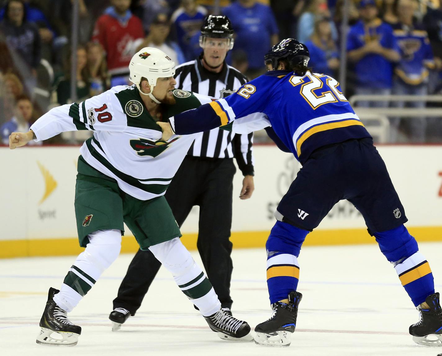 Minnesota Wild right wing Chris Stewart (10) and St. Louis Blues right wing Chris Thorburn (22) square off during the first period of an NHL preseason hockey game in Kansas City, Mo., Thursday, Sept. 28, 2017. Both received five-minute penalty for fighting. (AP Photo/Orlin Wagner)