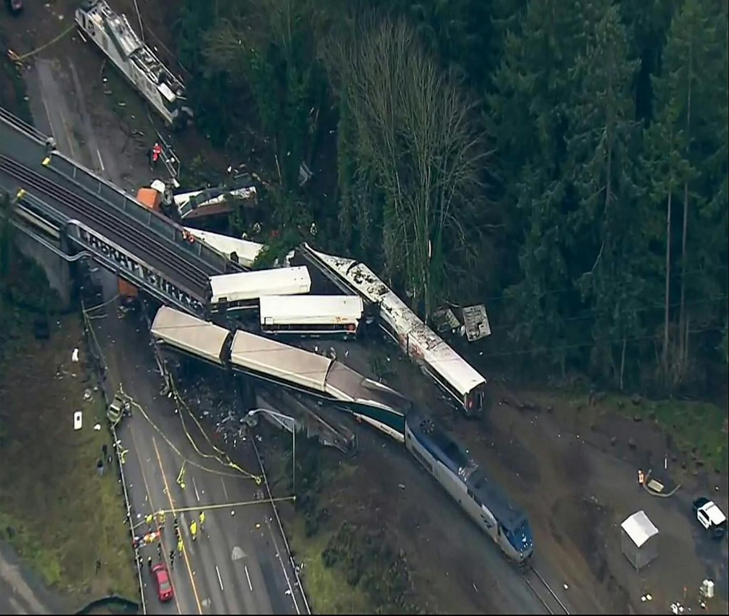 This aerial image from video provided by KOMO-TV, shows the site of an Amtrak train that derailed south of Seattle on Monday, Dec. 18, 2017.