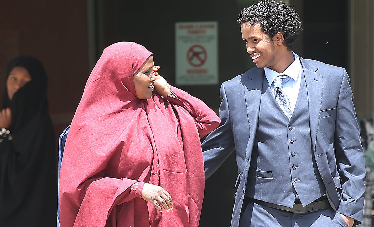 After spending seven months in federal detention, Mohamed Ali Omar, 21, right, was greeted by mostly female family members outside the federal courthouse, Tuesday, June 9, 2015 in Minneapolis, MN. ] (ELIZABETH FLORES/STAR TRIBUNE) ELIZABETH FLORES &#x2022; eflores@startribune.com