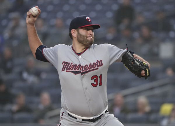 Minnesota Twins pitcher Lance Lynn (31) delivers against the New York Yankees during the first inning of a baseball game, Wednesday, April 25, 2018, i