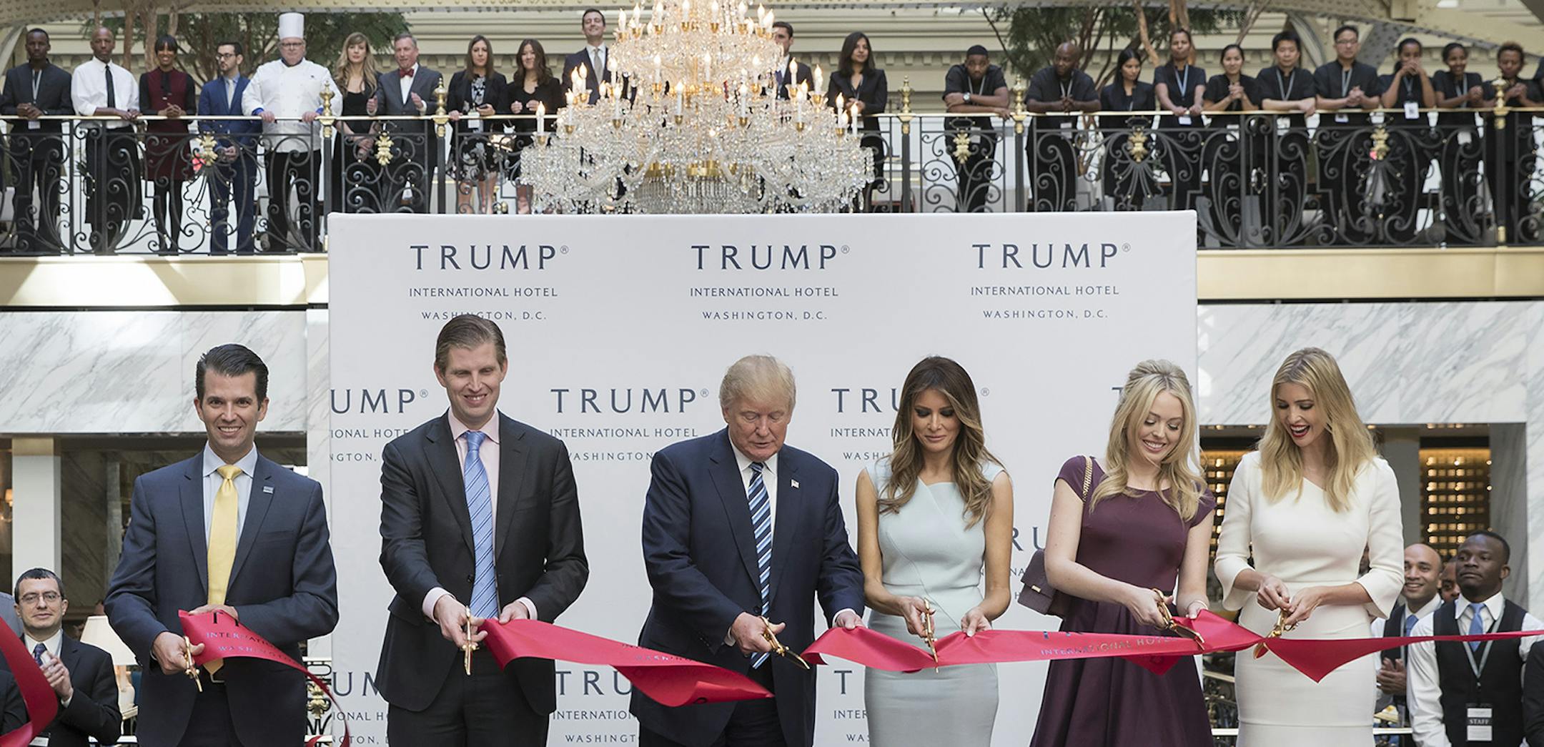 FILE ó Donald Trump, center, cuts the ribbon with his wife and children during the opening ceremony at Trump International Hotel in Washington, Oct. 26, 2016. President-elect Trump will have to find a way to ethically separate his official duties from his private business affairs, a feat made complicated when he turned management over to his children instead of an independent party. (Stephen Crowley/The New York Times) ORG XMIT: MIN2016112113434640