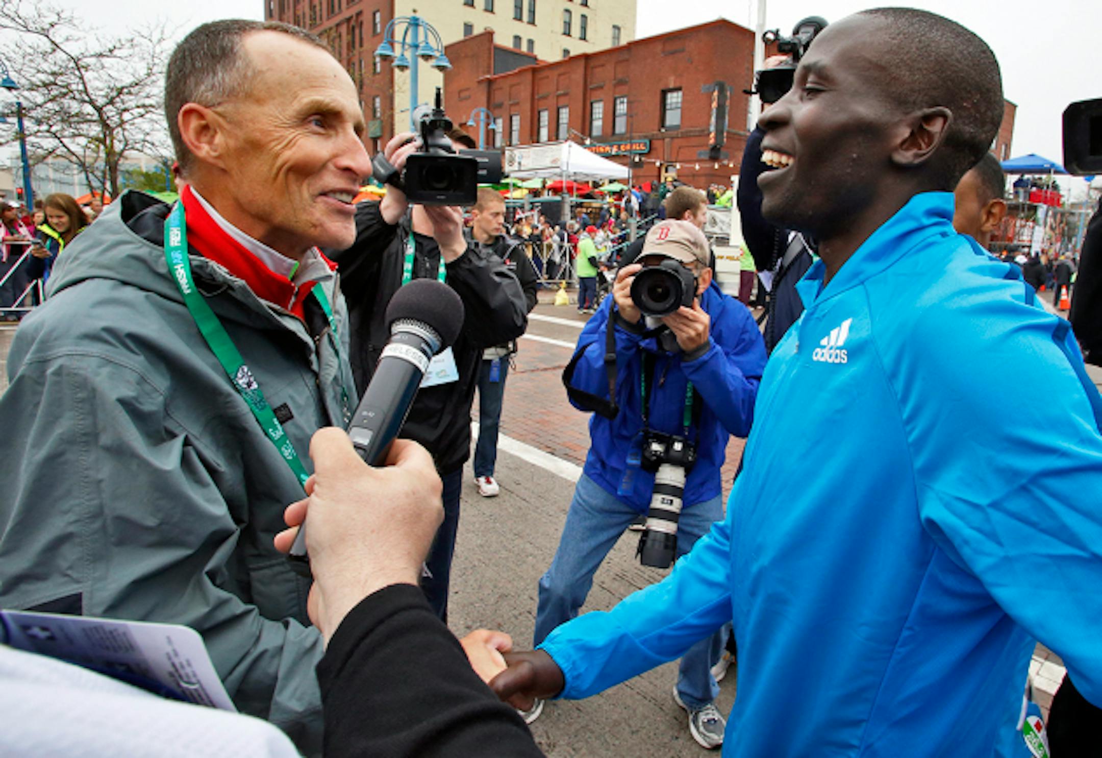 Former Grandmas Marathon record holder Dick Beardsley, left, congratulated new record holder and 2014 race winner Dominic Ondoro of Kenya.  ] The 38th running of Grandmas Marathon from Two Harbors to Canal Park in Duluth.  (MARLIN LEVISON/STARTRIBUNE(mlevison@startribune.com)