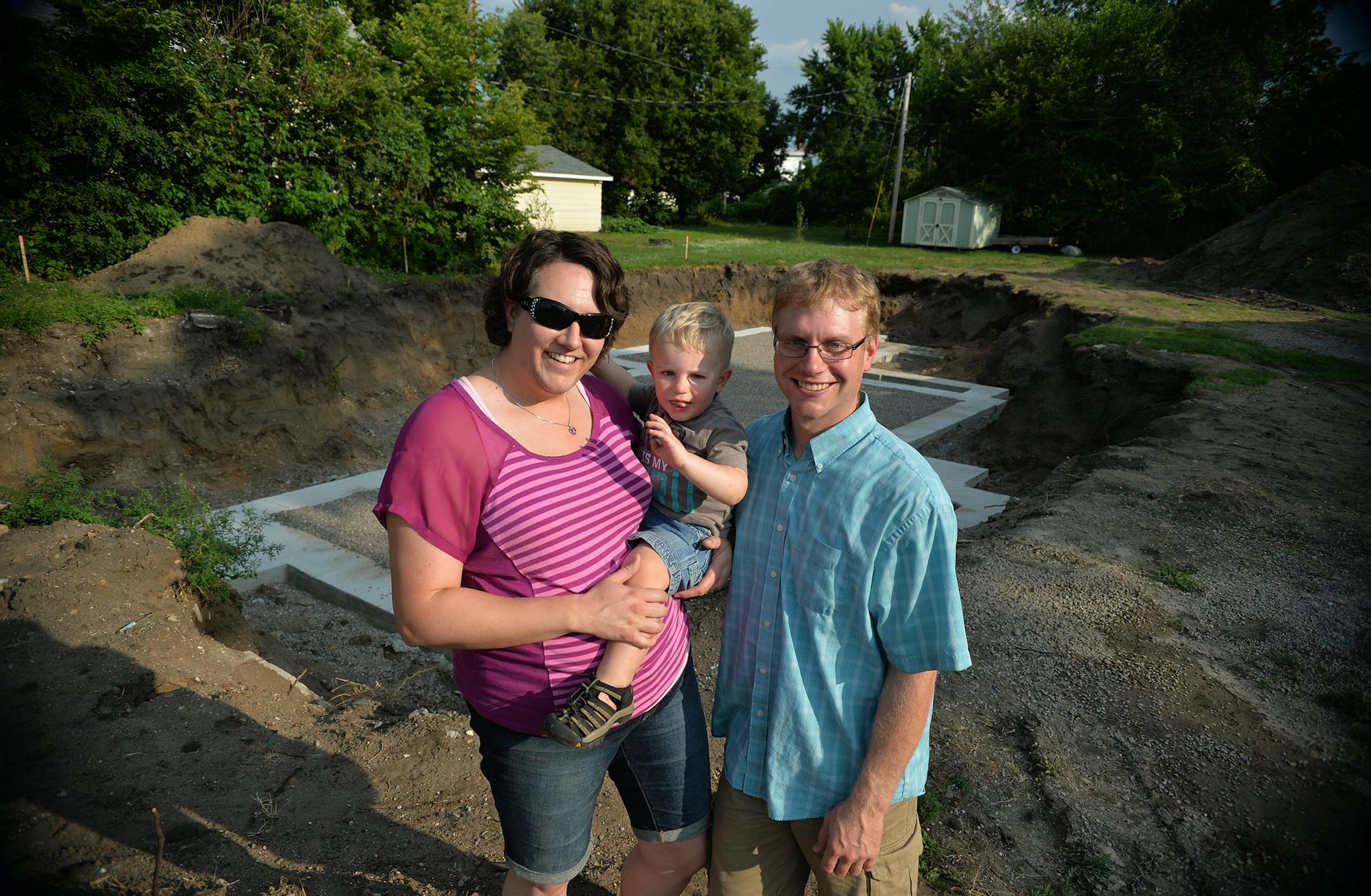 Amanda, Everett, 2, and Erik Skogquist in front of where their newly purchased 1880's historic Anoka home will soon sit. ] (SPECIAL TO THE STAR TRIBUNE/BRE McGEE) **Amanda Skogquist (left), Everett (center, 2), Erik Skogquist (right)