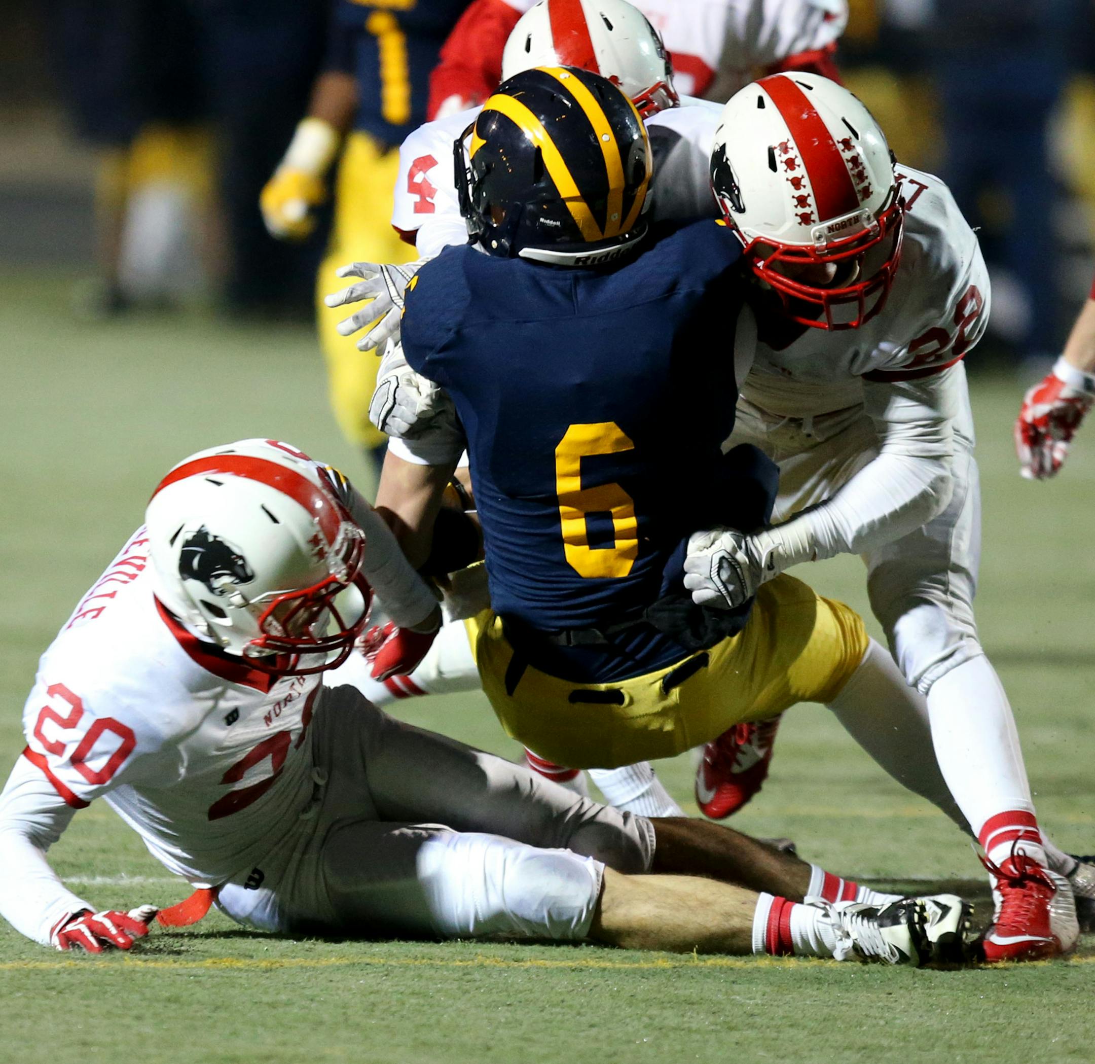 Rosemount's Tyler Hartigan got tackled by the Lakeville North defense short of the more than 30 yards needed for the first down during the second half. ] (KYNDELL HARKNESS/STAR TRIBUNE) kyndell.harkness@startribune.com Rosemount vs Lakeville North during the state quarterfinal game in Edina, Min., Thursday, November 6, 2014. Lakeville North won over Rosemount 14-13.