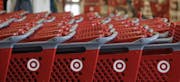FILE- In this Thursday, July 5, 2012, file photo, rows of carts await customers at a Target store in Chicago. Discount retailer Target Corp. said Thur