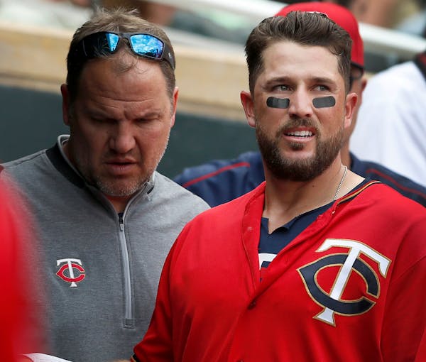Head athletic trainer Dave Pruemer checked on Twins third baseman Trevor Plouffe, who left Sunday's game against the Angels in the 11th inning.