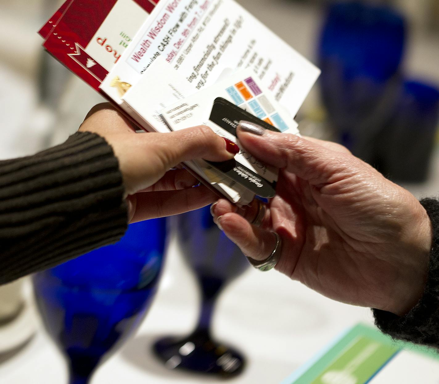 Event information and business cards are passed around during the Women in Networking (WIN) monthly breakfast at the Downtowner Woodfire Grill in St. Paul December 8, 2015. (Courtney Perry/Special to the Star Tribune)