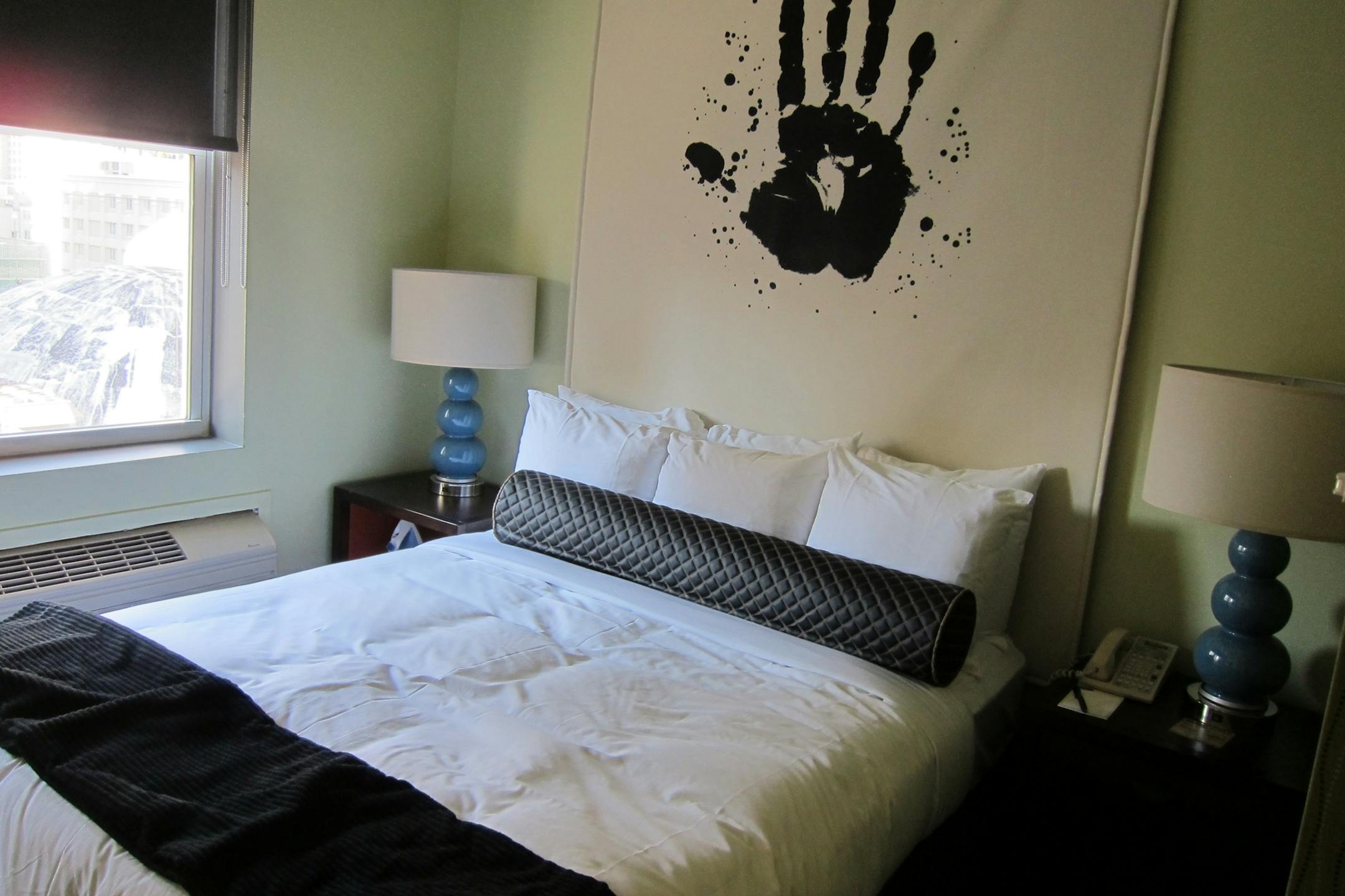 A room at the Acme in Chicago features retro lamps and graphic artwork.