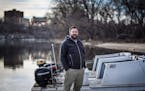 University of Minnesota men's rowing coach Aaron Schnell received a citizen's award from university police for helping in the rescue of a man who fell