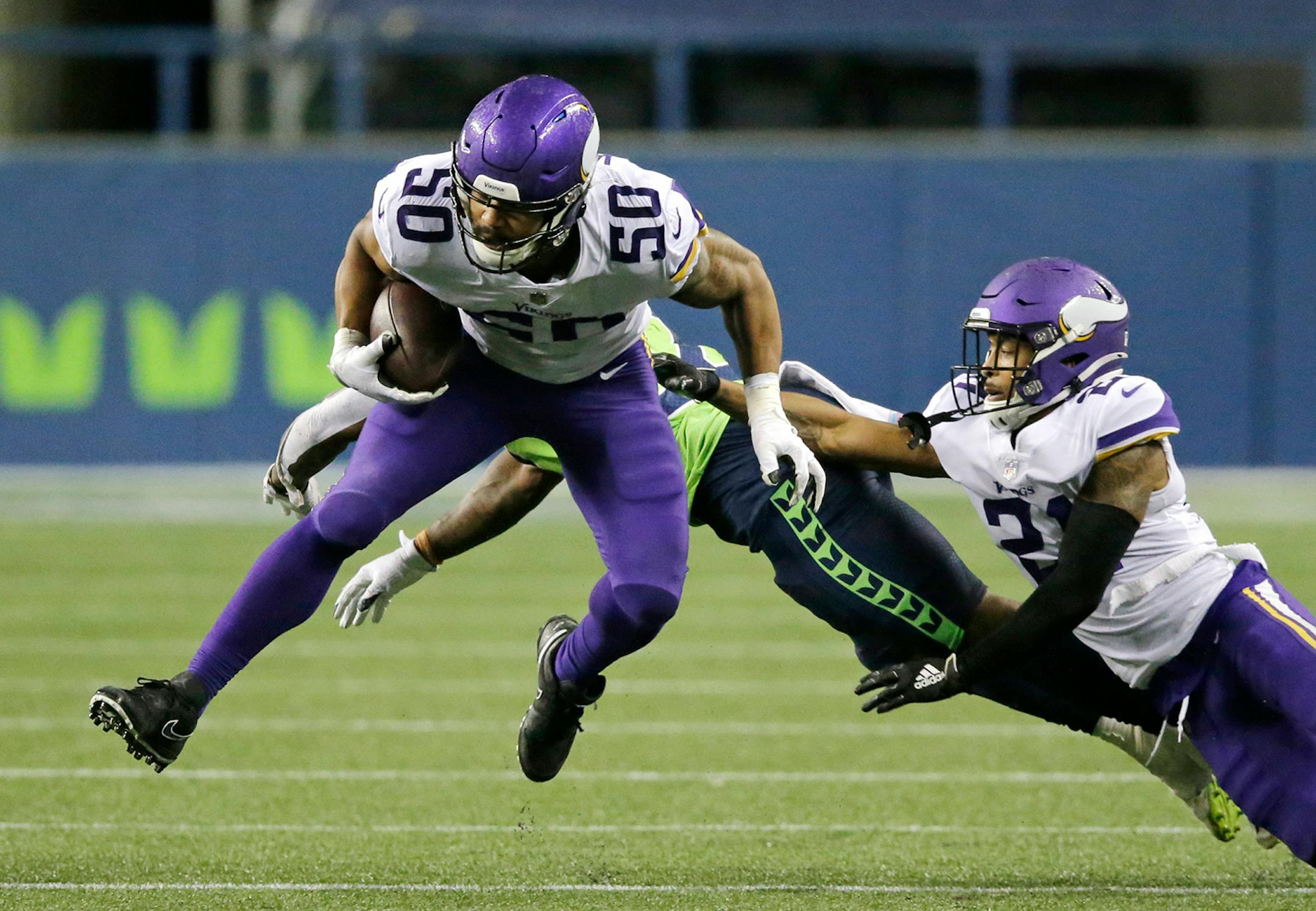 Minnesota Vikings linebacker Eric Wilson (50) returns an interception against the Seattle Seahawks during the second half of an NFL football game, Sunday, Oct. 11, 2020, in Seattle. (AP Photo/John Froschauer)